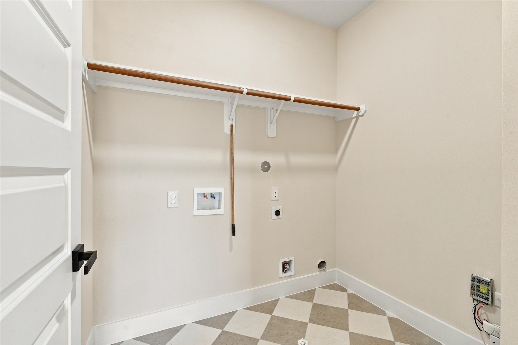 Organized utility room  convenient laundry station keeping household chores simple and contained.