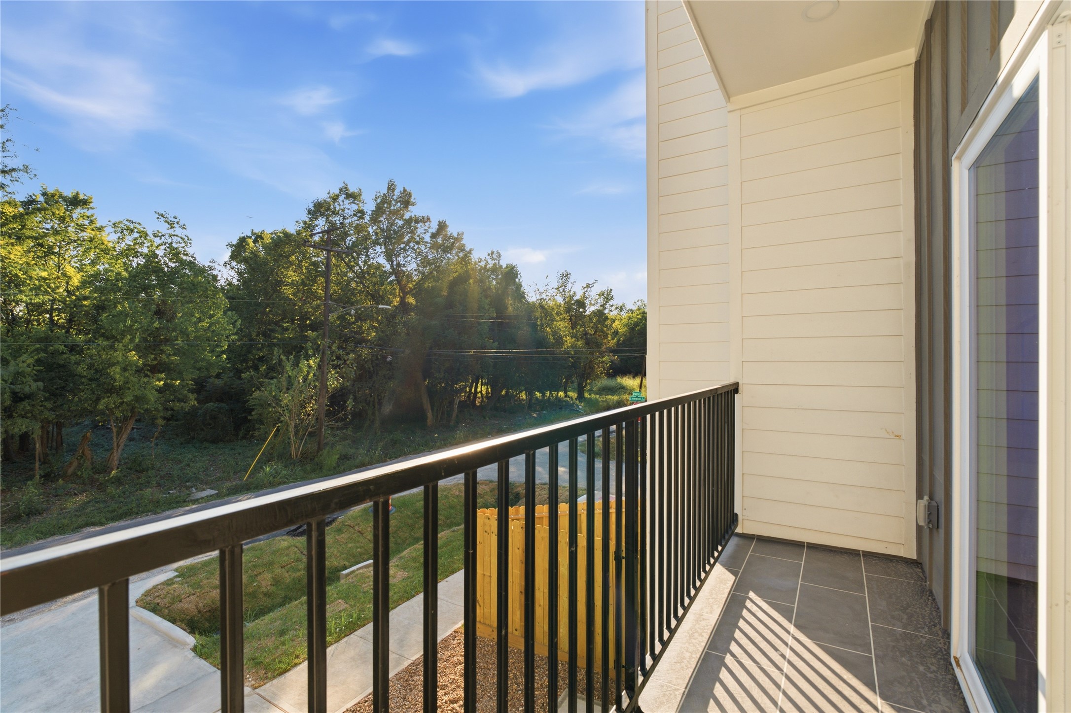 Elevated private balcony  sip evening drinks in peace with serene treetop surroundings.