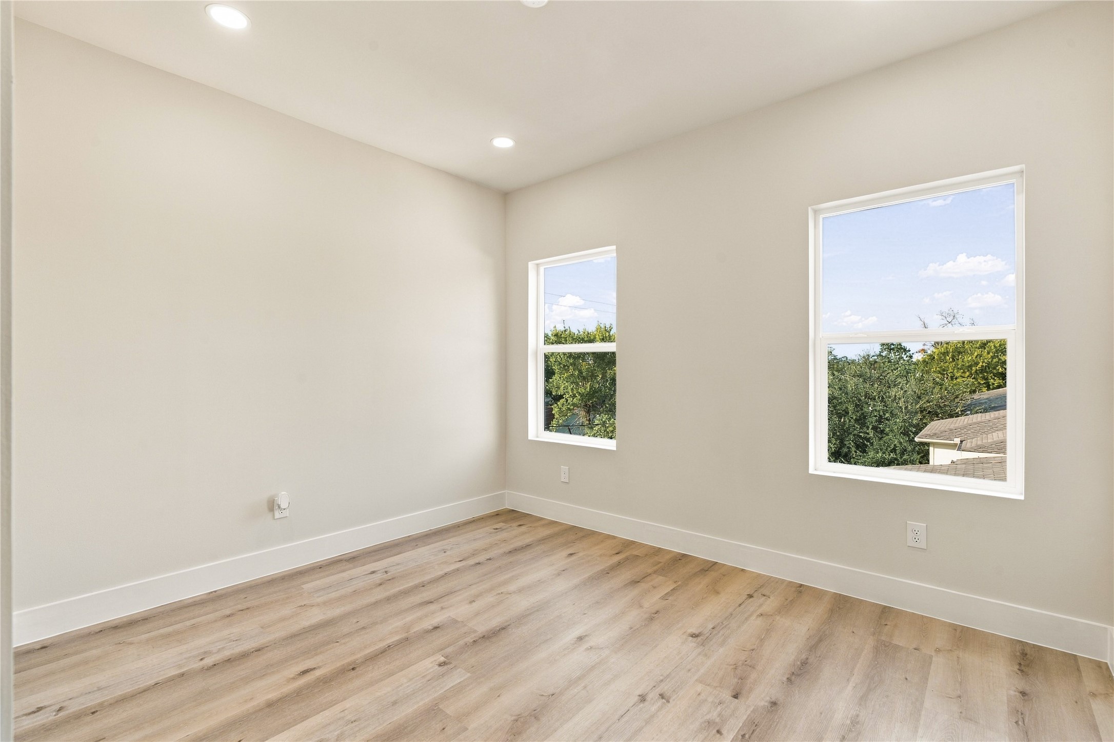 Sun-kissed guest quarters  warm, welcoming bedroom space ready to accommodate family or overnight visitors.