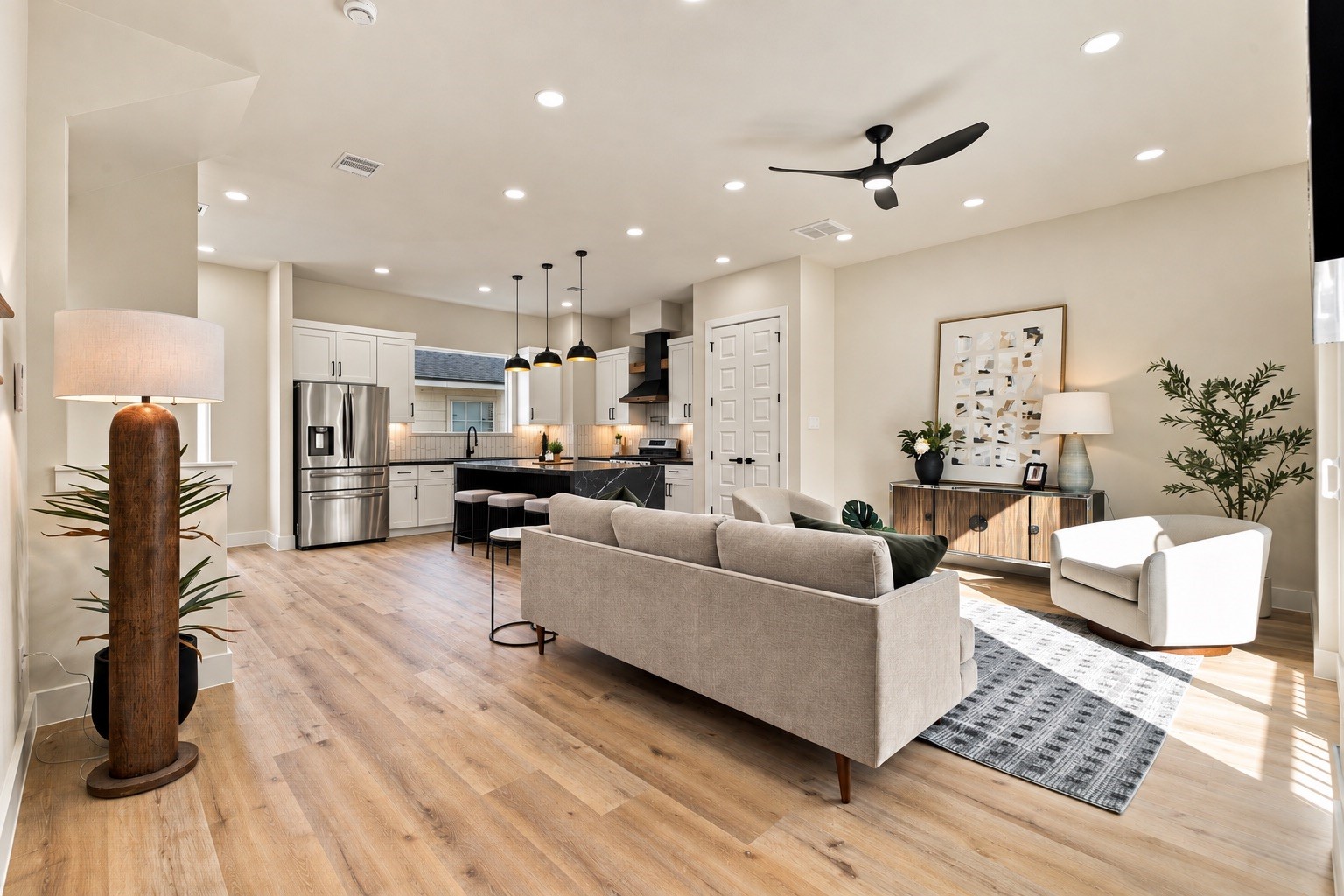 Spacious main floor retreat  open, airy gathering room built for hosting game nights or curling up with a book.