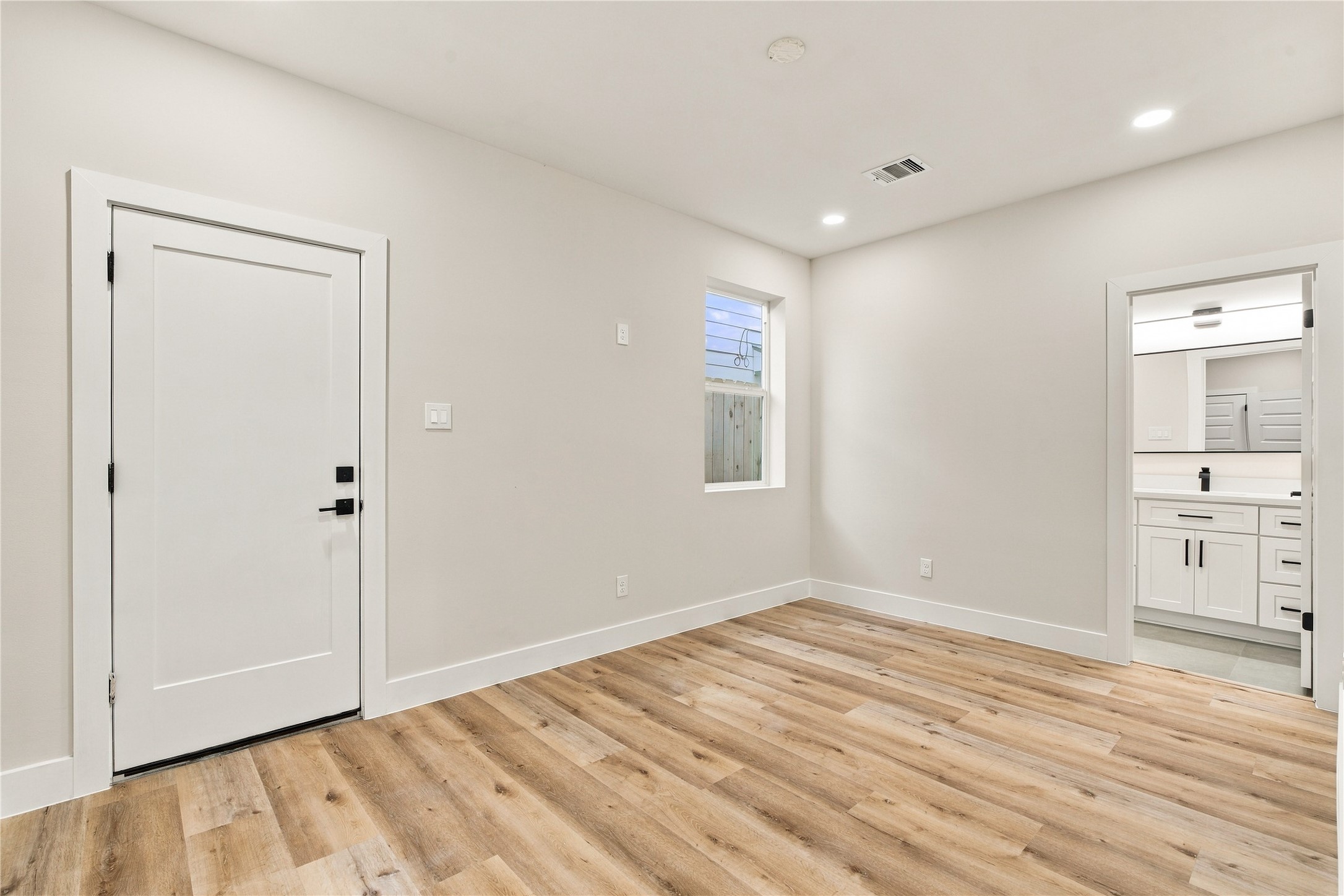 Versatile ground-floor suite  perfect setup for a quiet home office, private guest quarters, or personal gym.