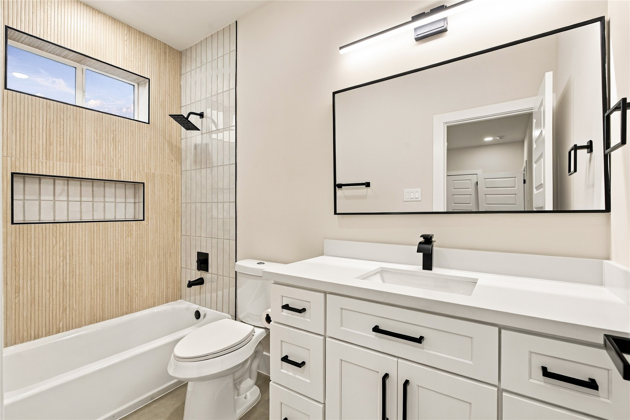Fresh guest sanctuary  sparkling bath setup where visitors can refresh and feel right at home.