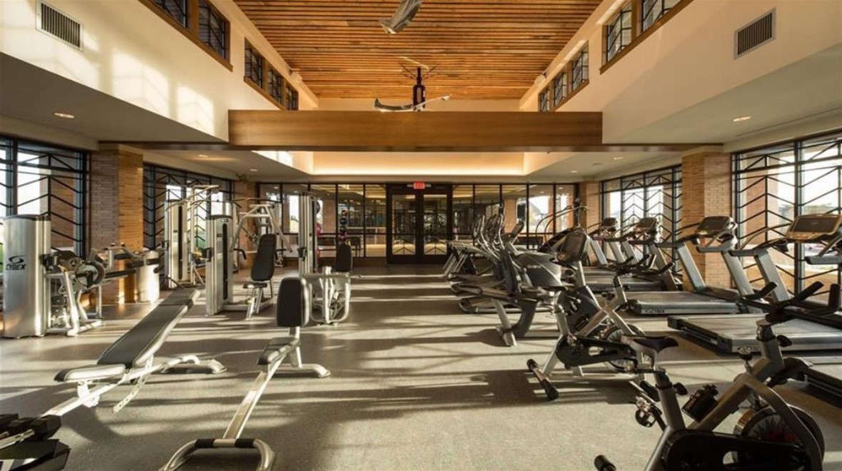 Elyson residents enjoy access to a well-equipped fitness center featuring cardio equipment, strength-training machines, and dedicated workout areas.
