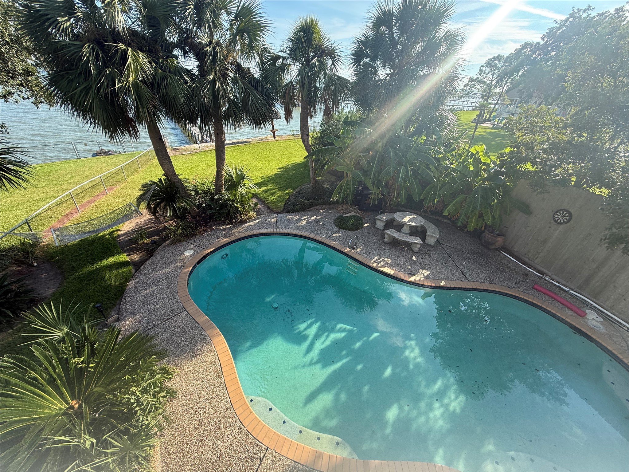 View of pool from Primary upstairs balcony.