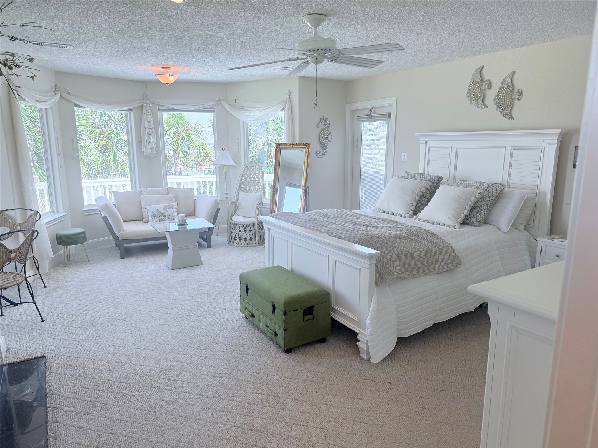 Primary bedroom has extra sitting area.