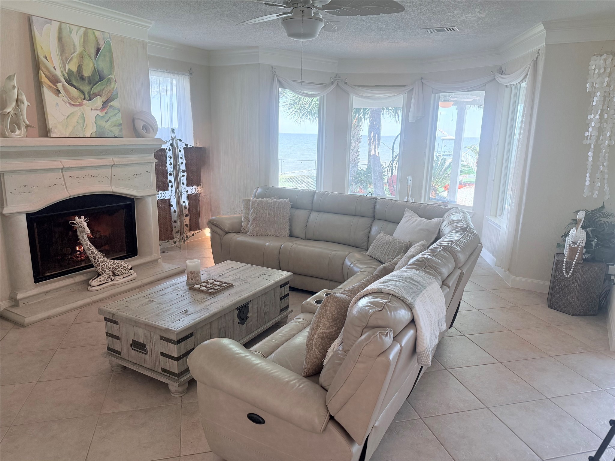 Open plan living room with a gas fireplace.
