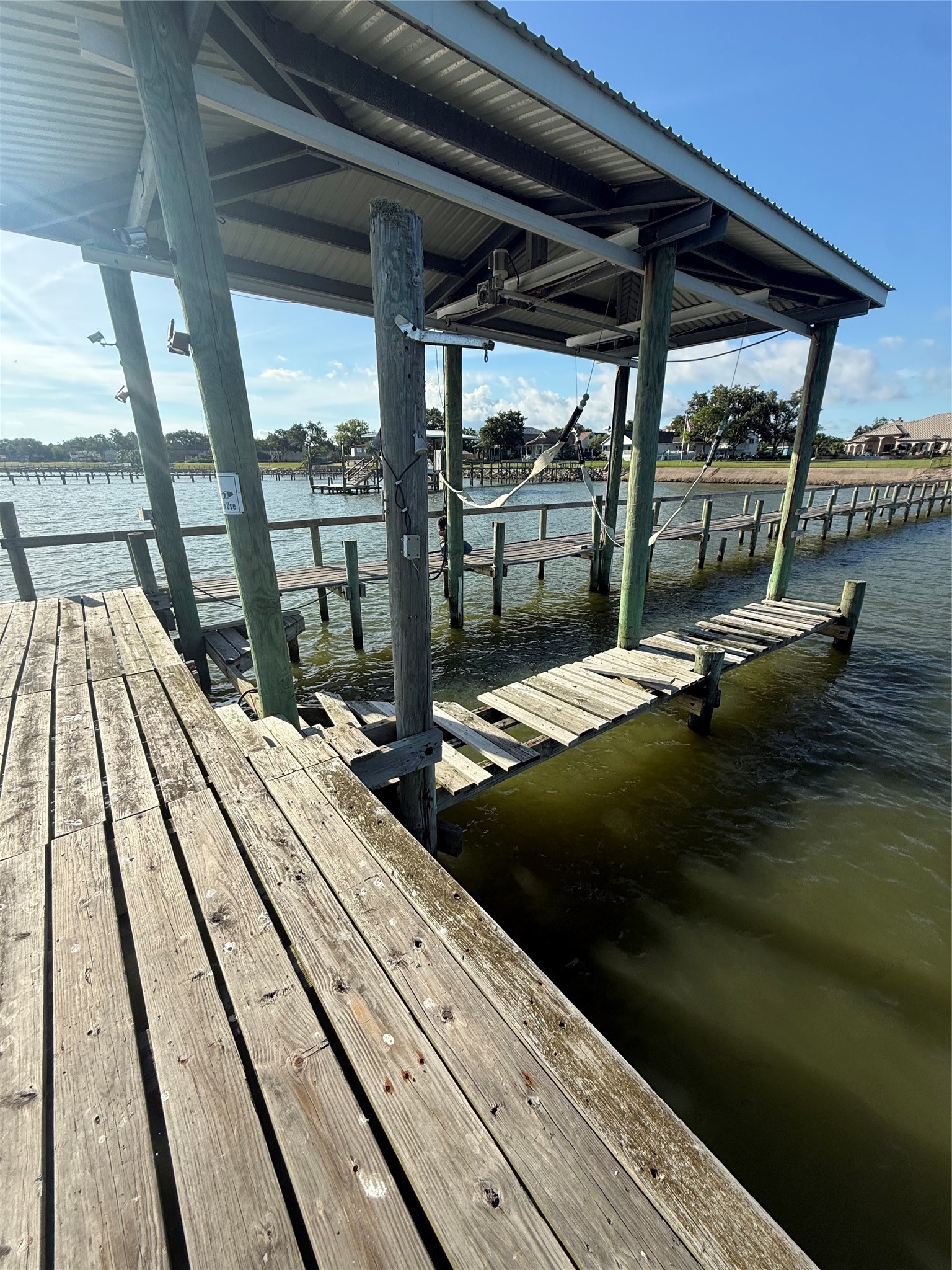 Boat lift at the end of the pier.
