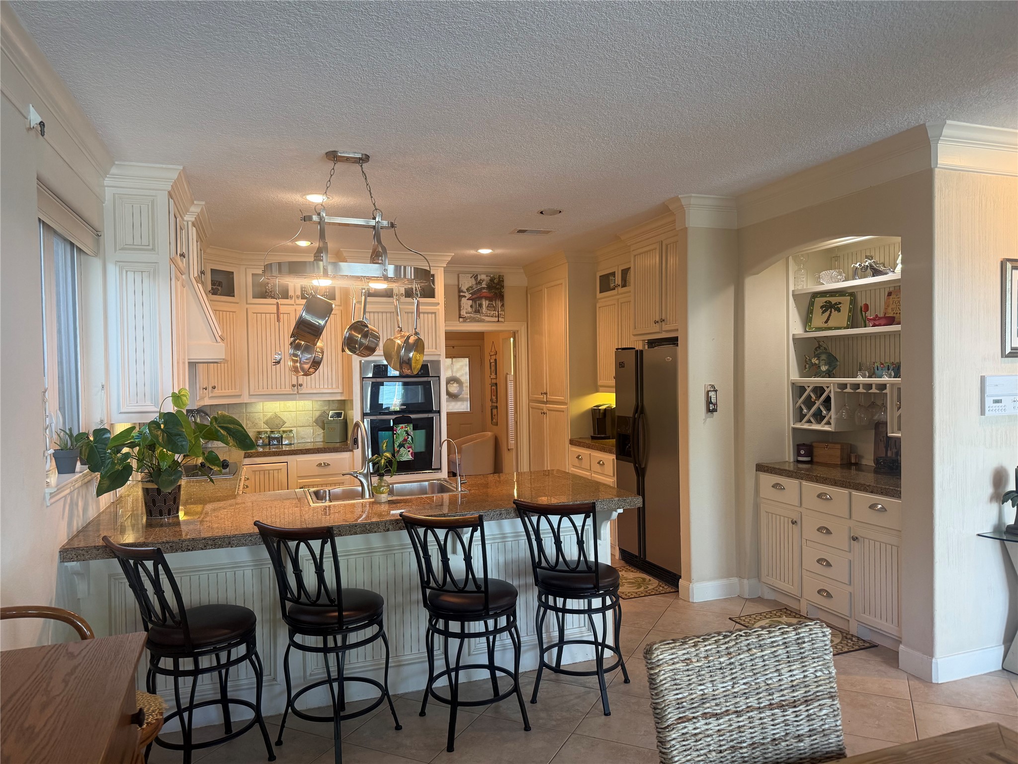 Island off the kitchen with room for barstools.