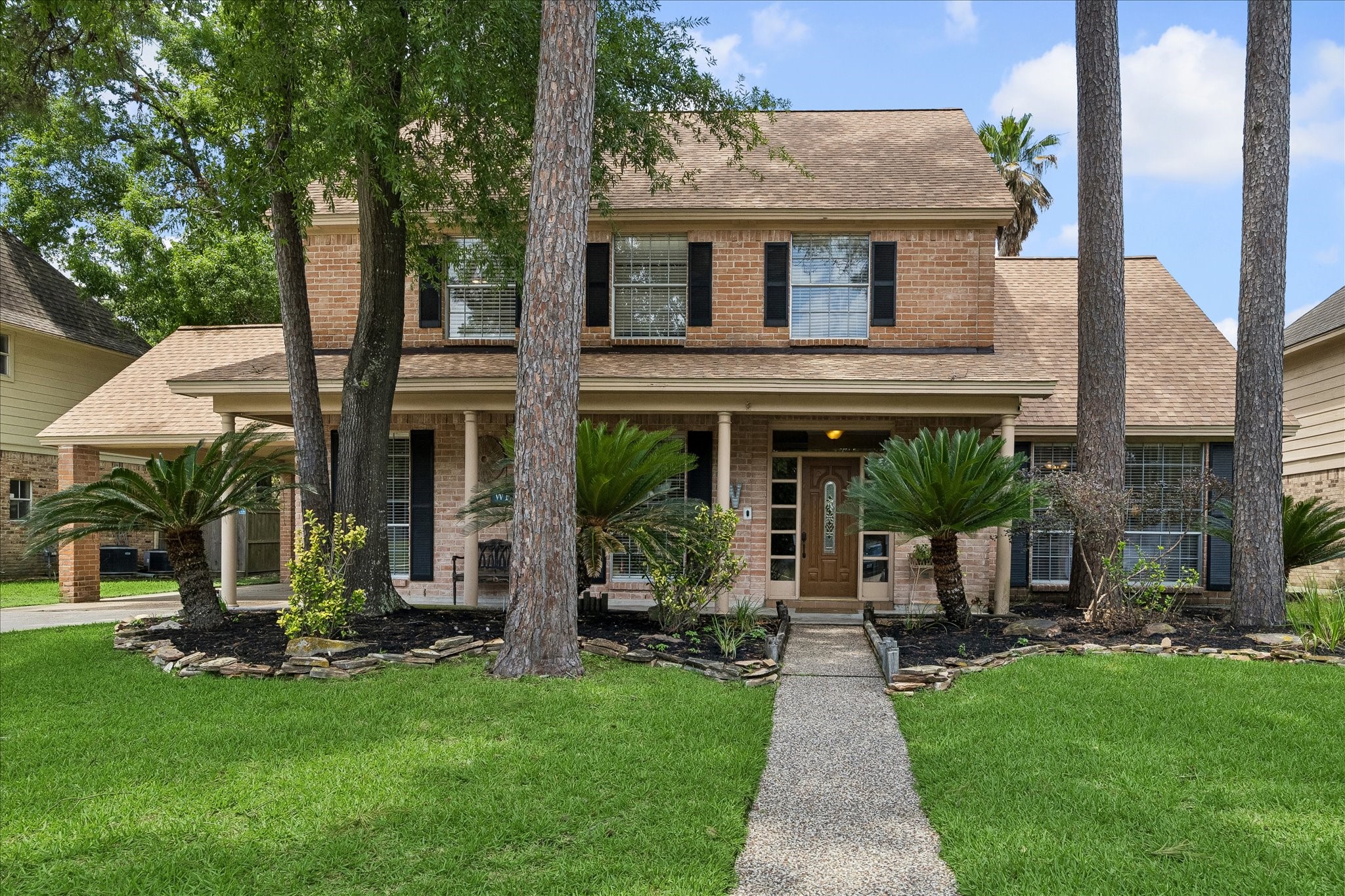 What a charming elevation.  This home looks happy at all times.