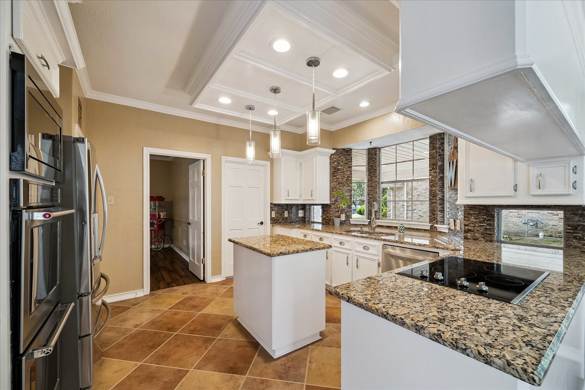 Another view of the kitchen.  A very large laundry room is just though the door.