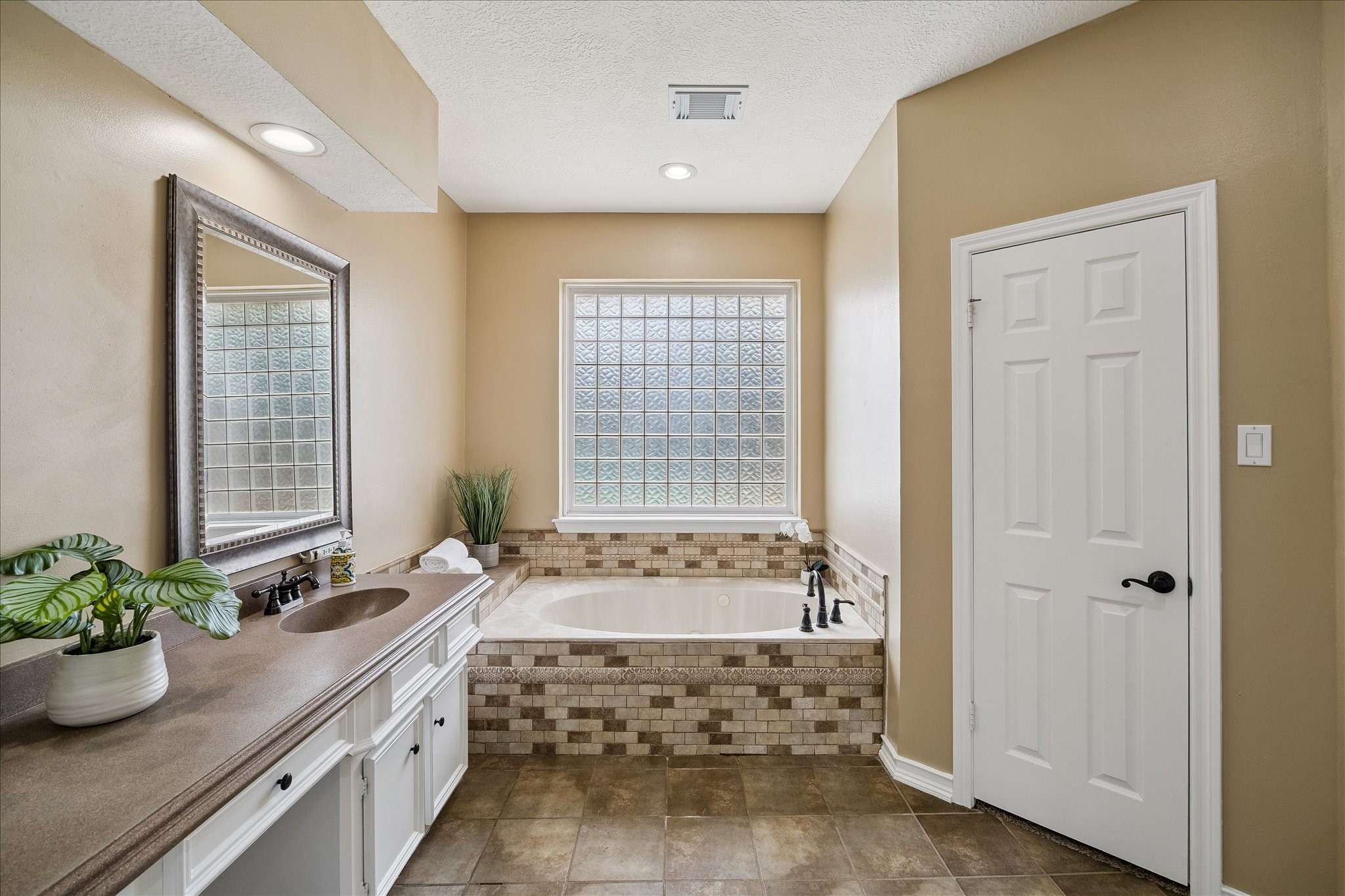 Plenty of room here.  There are his/ her closets.  The shower is just to the right.