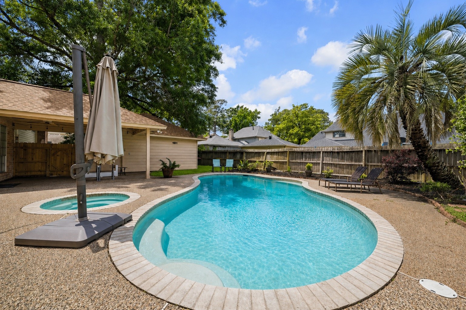 Enjoy your large pool with a hot tub.