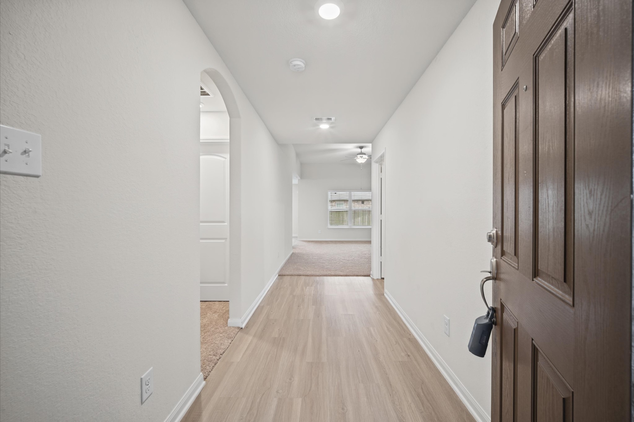 Nice entry with solid surfaced flooring.