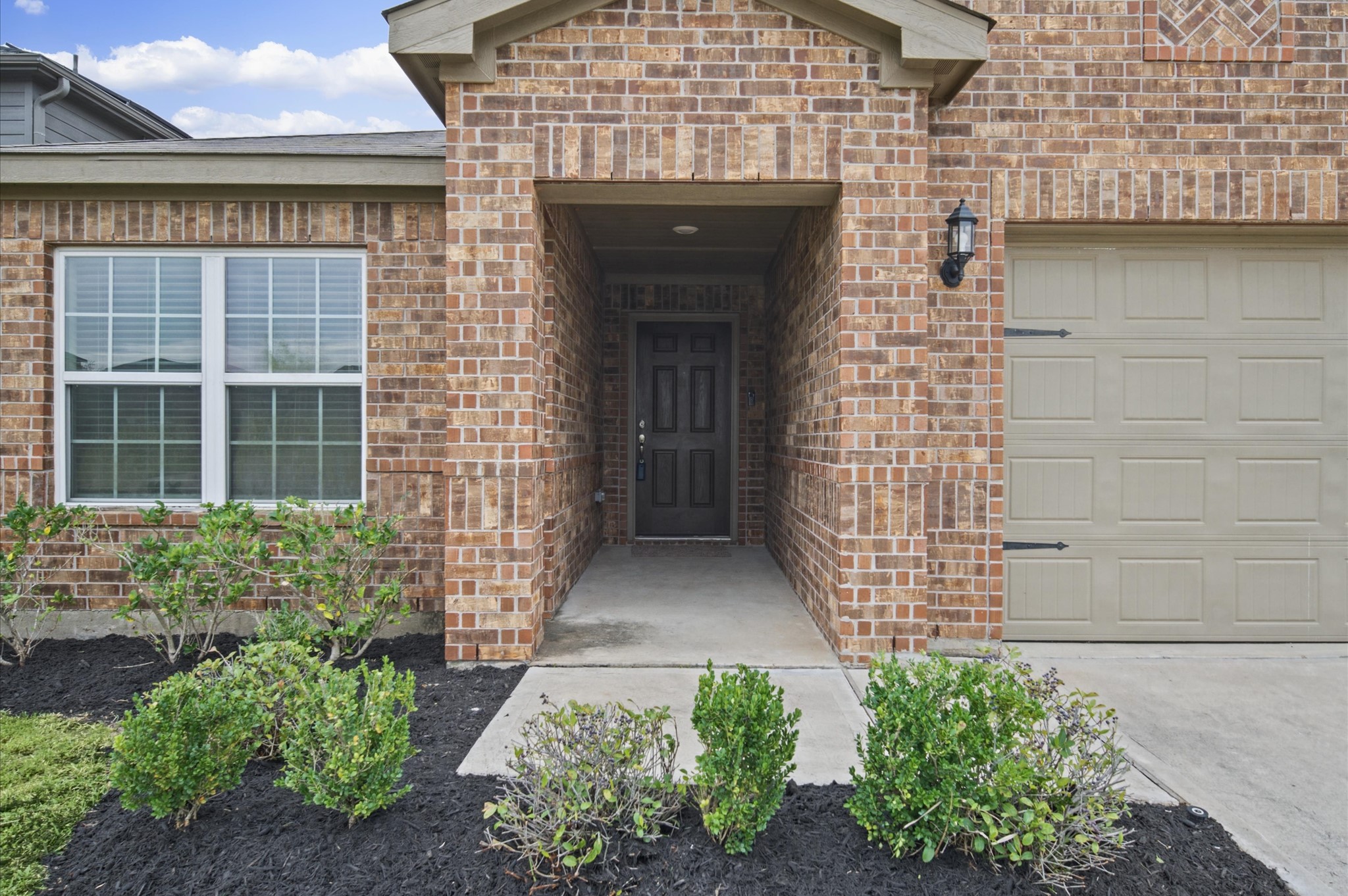 Great home with a nice entry way and fresh landscaping!