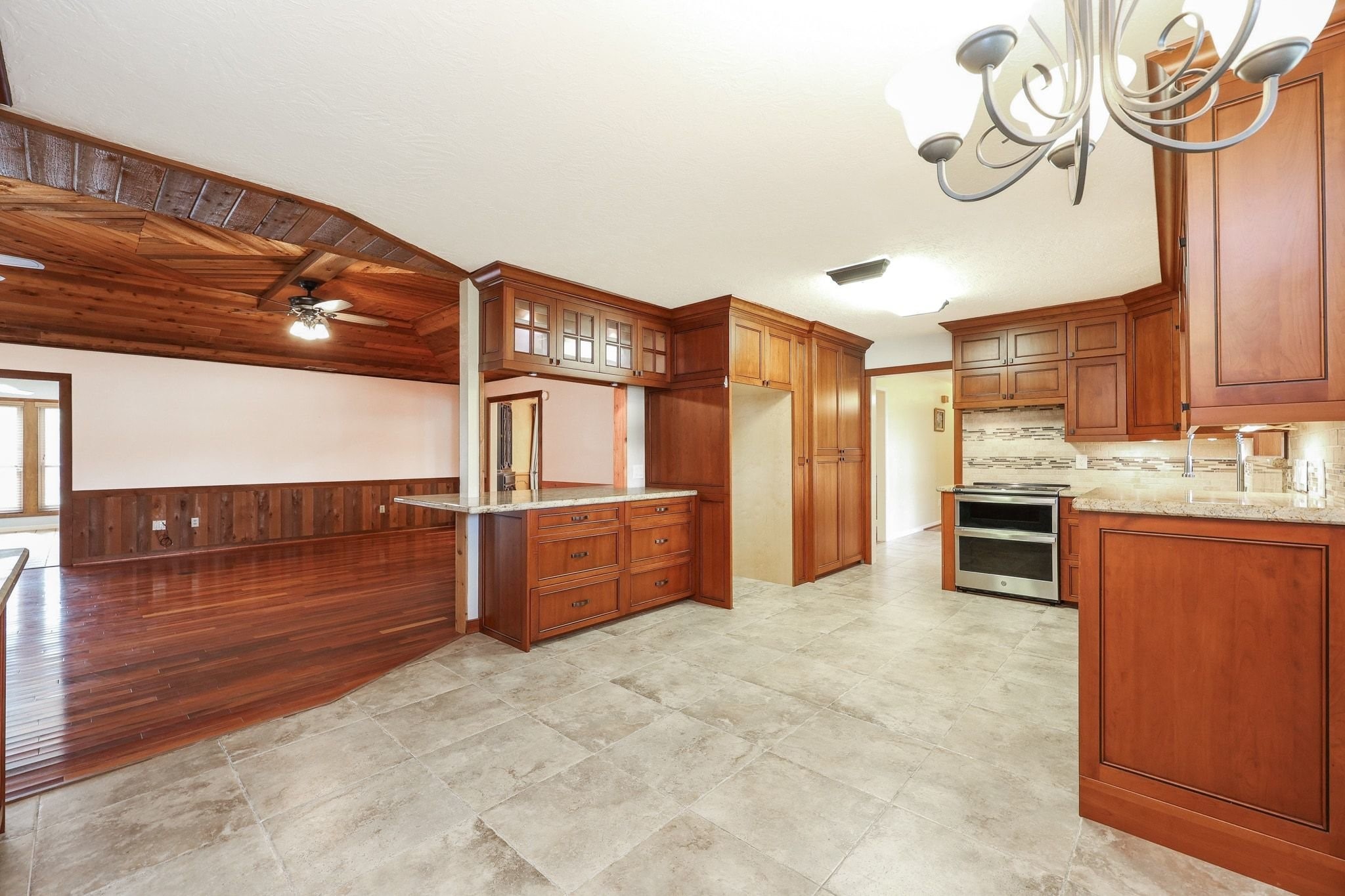 Kitchen with Custom Cabinets, a Double Electric Oven, Pantry Storage, Microwave Shelf has Beautiful Views of the Neighborhood Lake