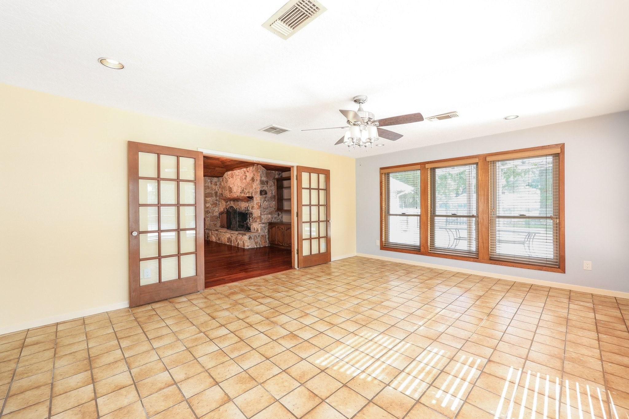 The Game Room/Flex Room is located off the Family Room with Views of the Back Yard Swimming Pool