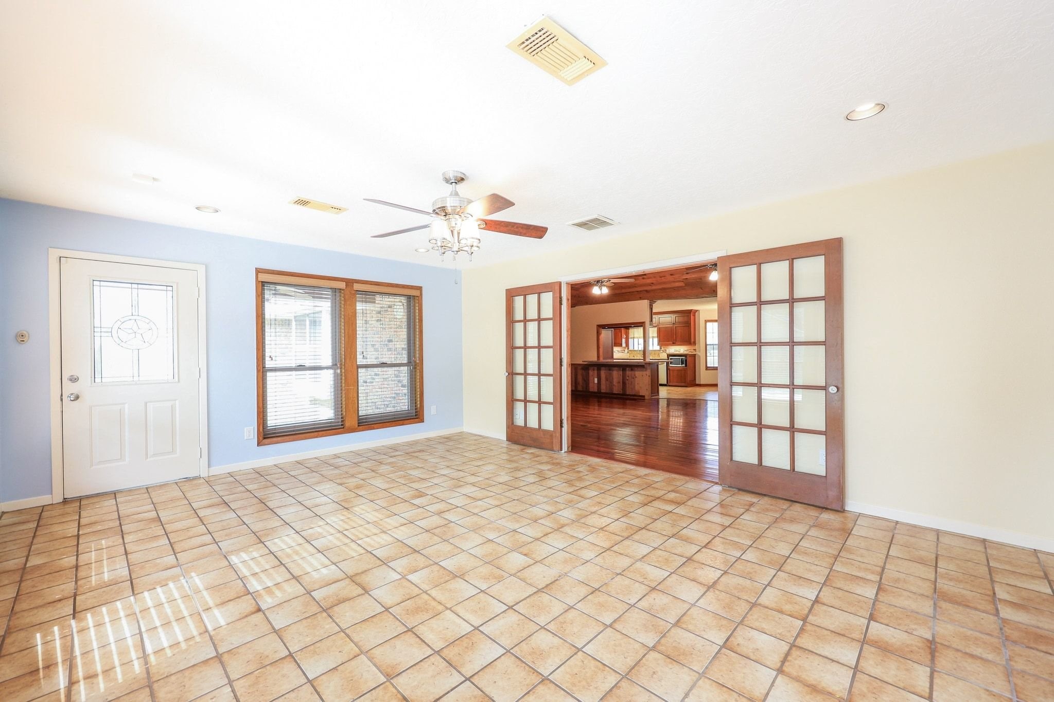 The Game Room/Flex Room is located off the Family Room with Views of the Back Yard Swimming Pool