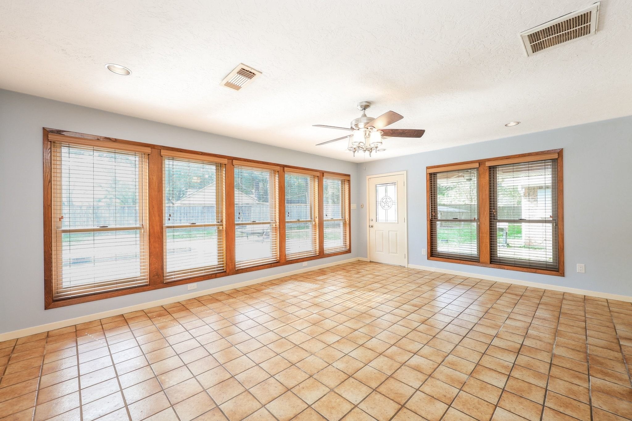 The Game Room/Flex Room is located off the Family Room with Views of the Back Yard Swimming Pool