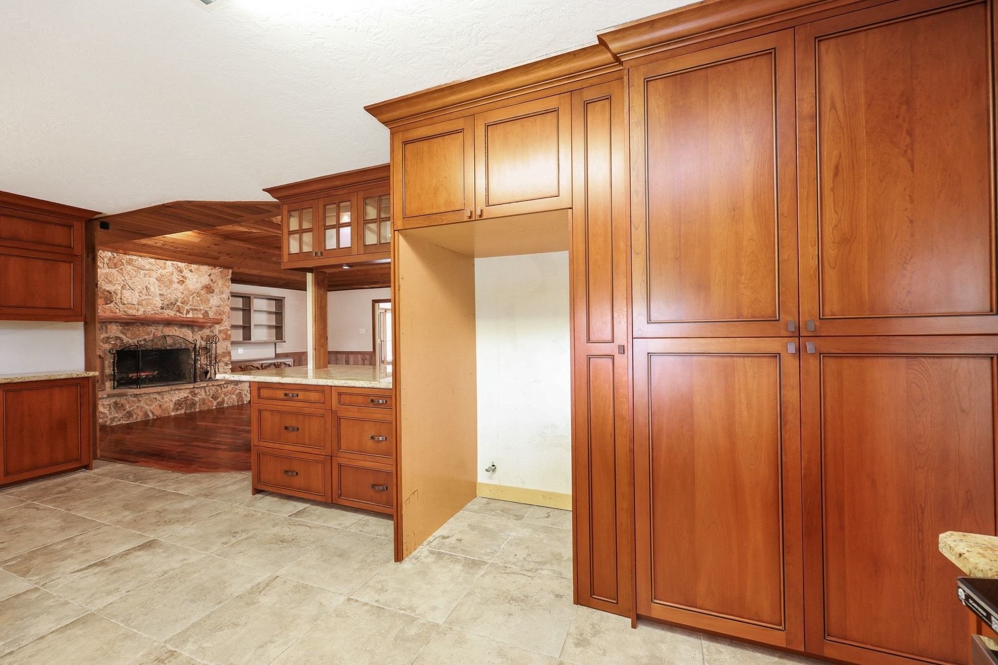 Kitchen with Custom Cabinets, a Double Electric Oven, Pantry Storage, Microwave Shelf has Beautiful Views of the Neighborhood Lake