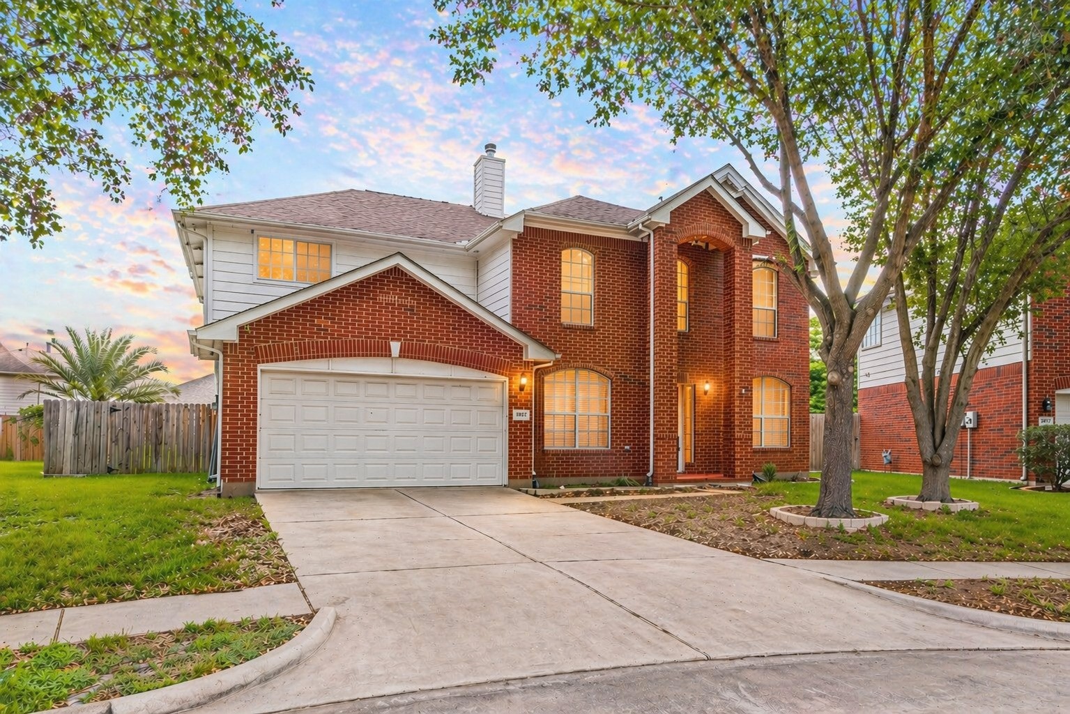 Charming curb appeal on a quiet cul-de-sac with inviting front elevation and fresh landscaping.