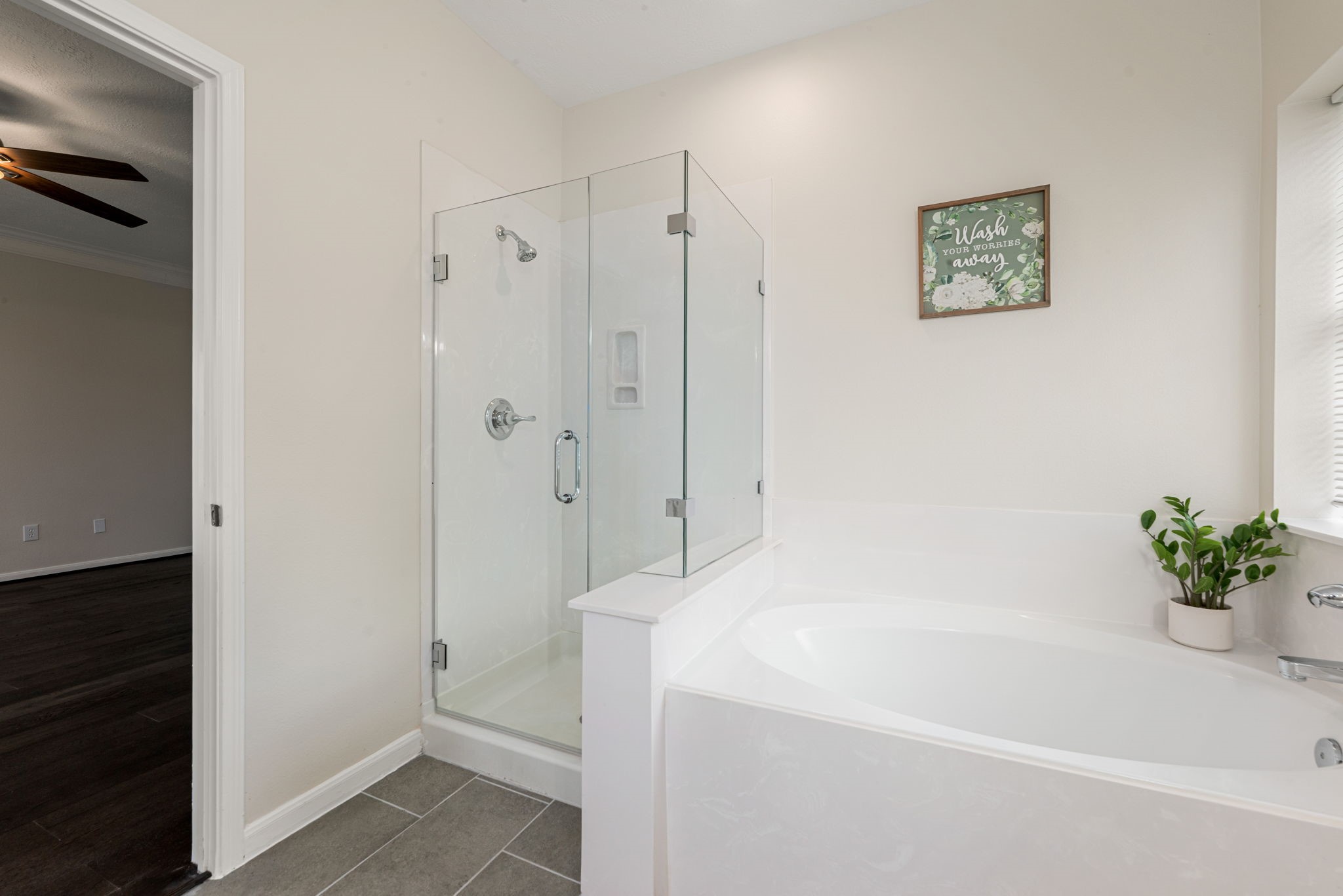 Primary bathroom with double sinks, garden tub, and separate shower.