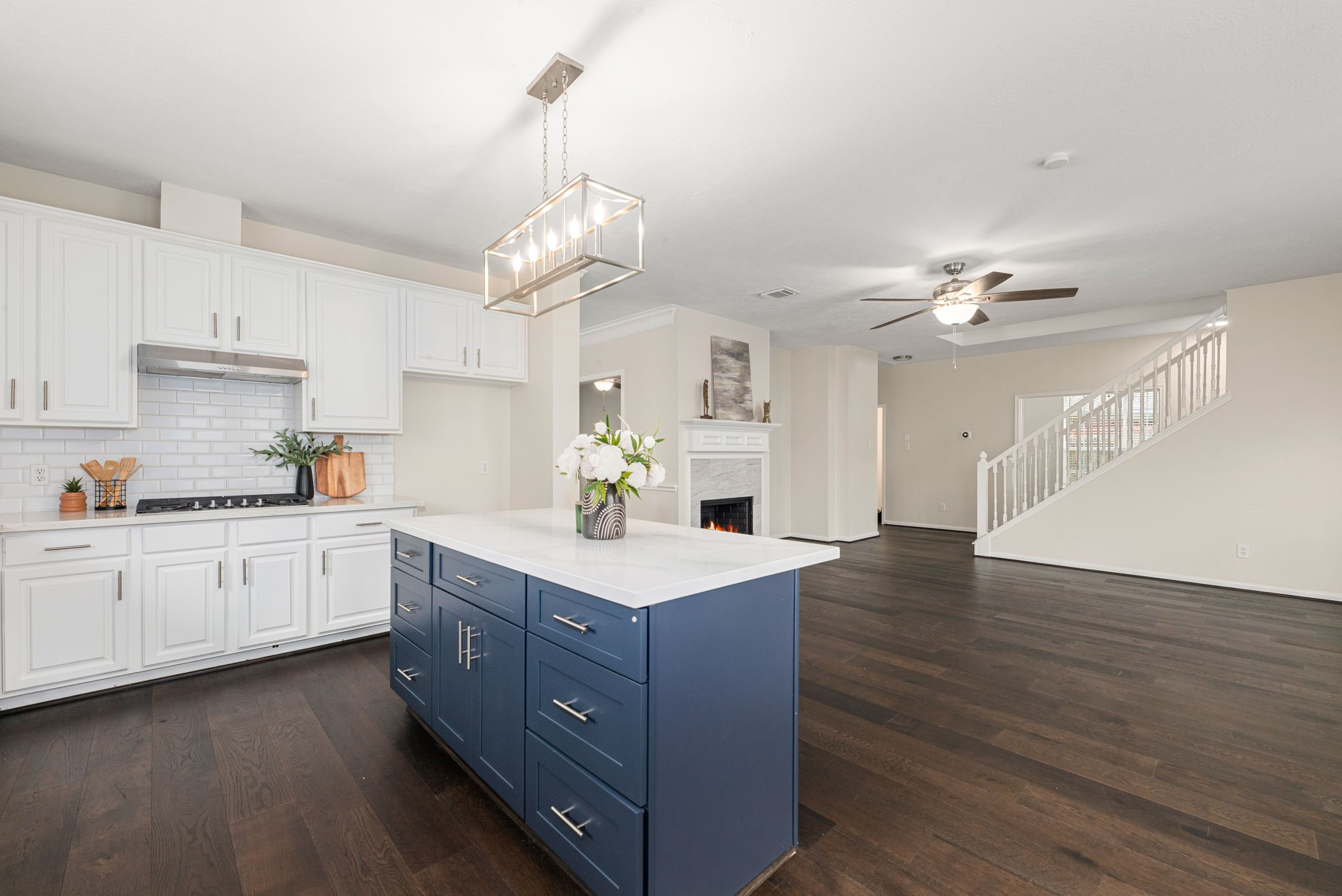 Open-concept design seamlessly connects living, dining, and kitchen for everyday living and entertaining.
