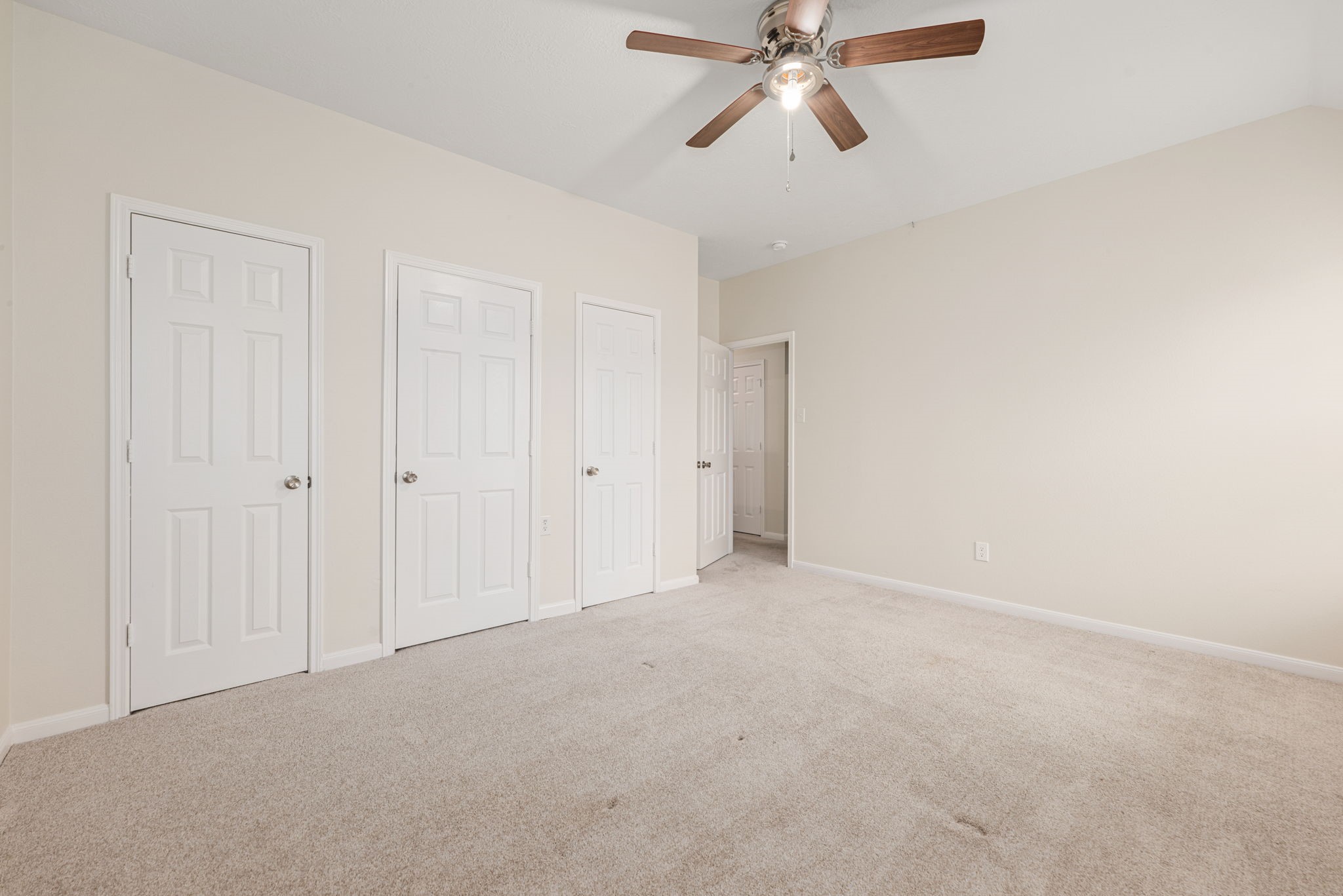 Primary suite tucked away for privacy with a relaxing and spacious layout.