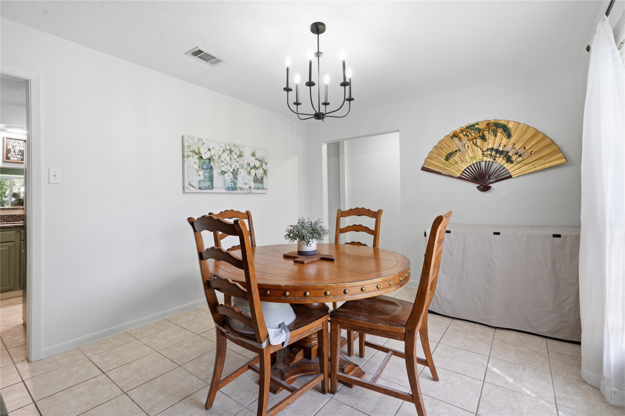 Dedicated dining room with abundant natural light, updated lighting fixture, and easy access to the kitchen. Dedicated dining room with abundant natural light, updated lighting fixture, and easy access to the kitchen.