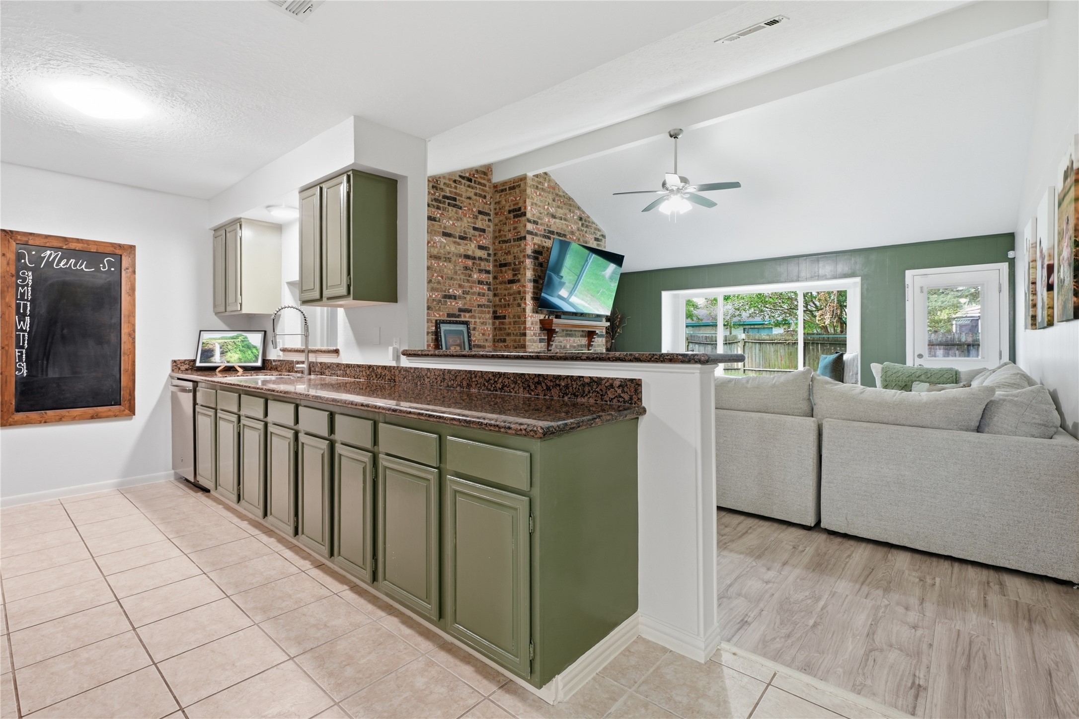 Open-concept kitchen overlooking the living room, featuring generous prep space, a breakfast bar, and excellent flow for entertaining. Open-concept kitchen overlooking the living room, featuring generous prep space, a breakfast bar, and excellent flow for entertaining.