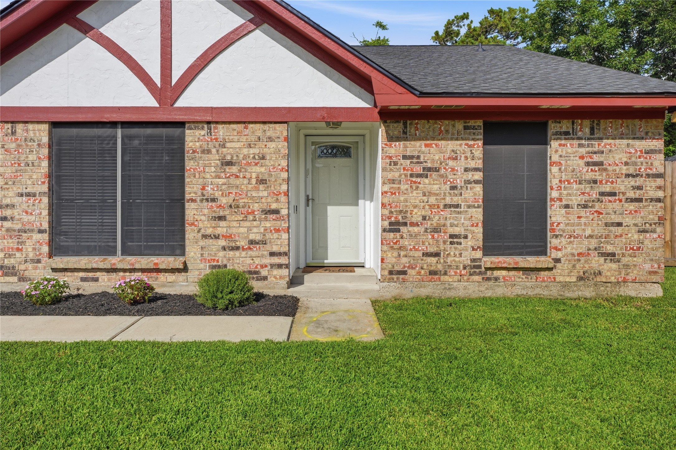 Attractive front elevation showcasing a spacious front yard and decorative architectural accents. Attractive front elevation showcasing a spacious front yard and decorative architectural accents.