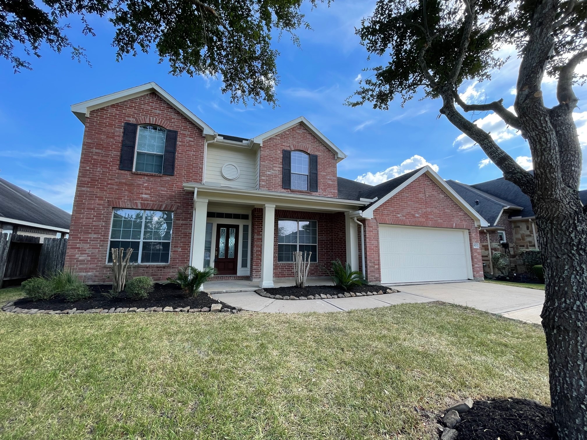 Front and backyard both with covered porch