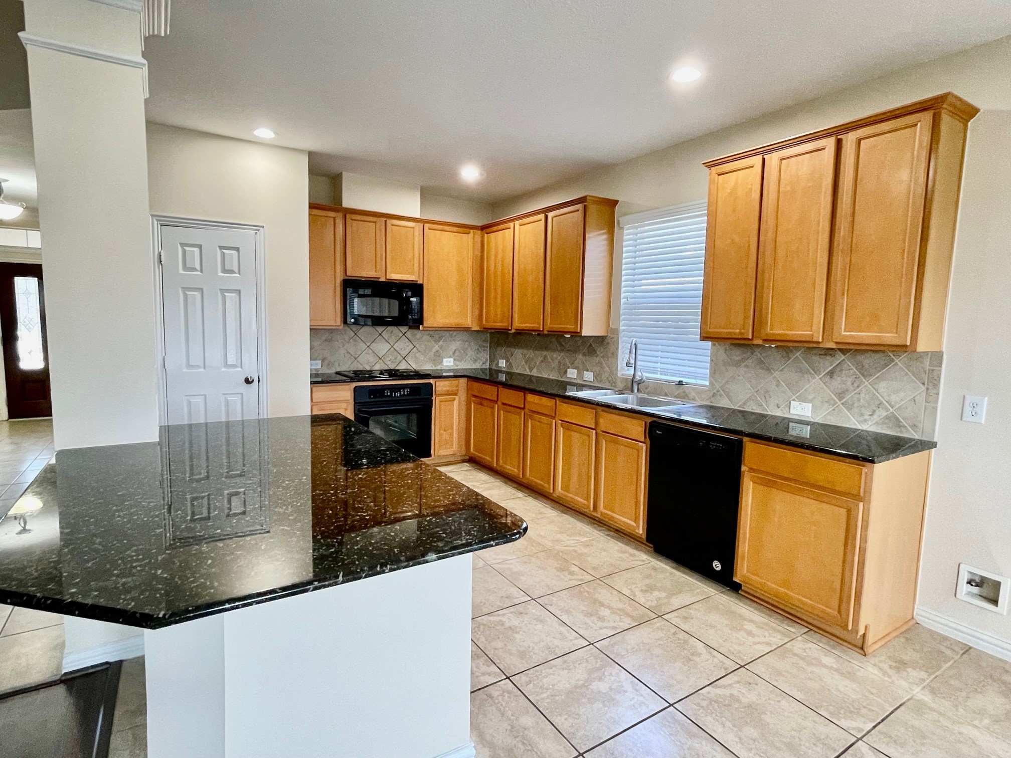 Spacious Granted island kitchen overlook the family room