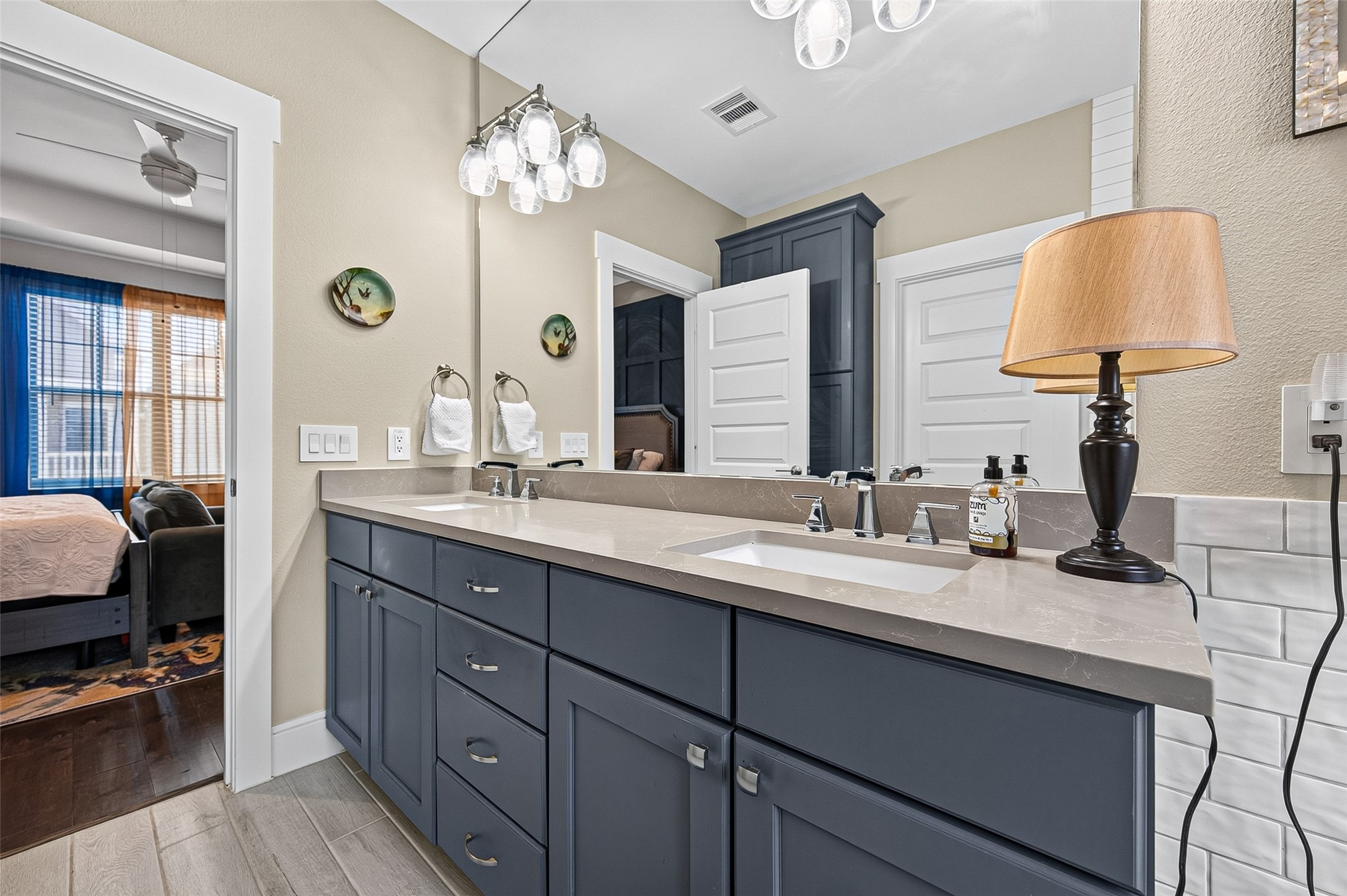 Plenty of counter space, oversized mirror and beautiful accent lighting.