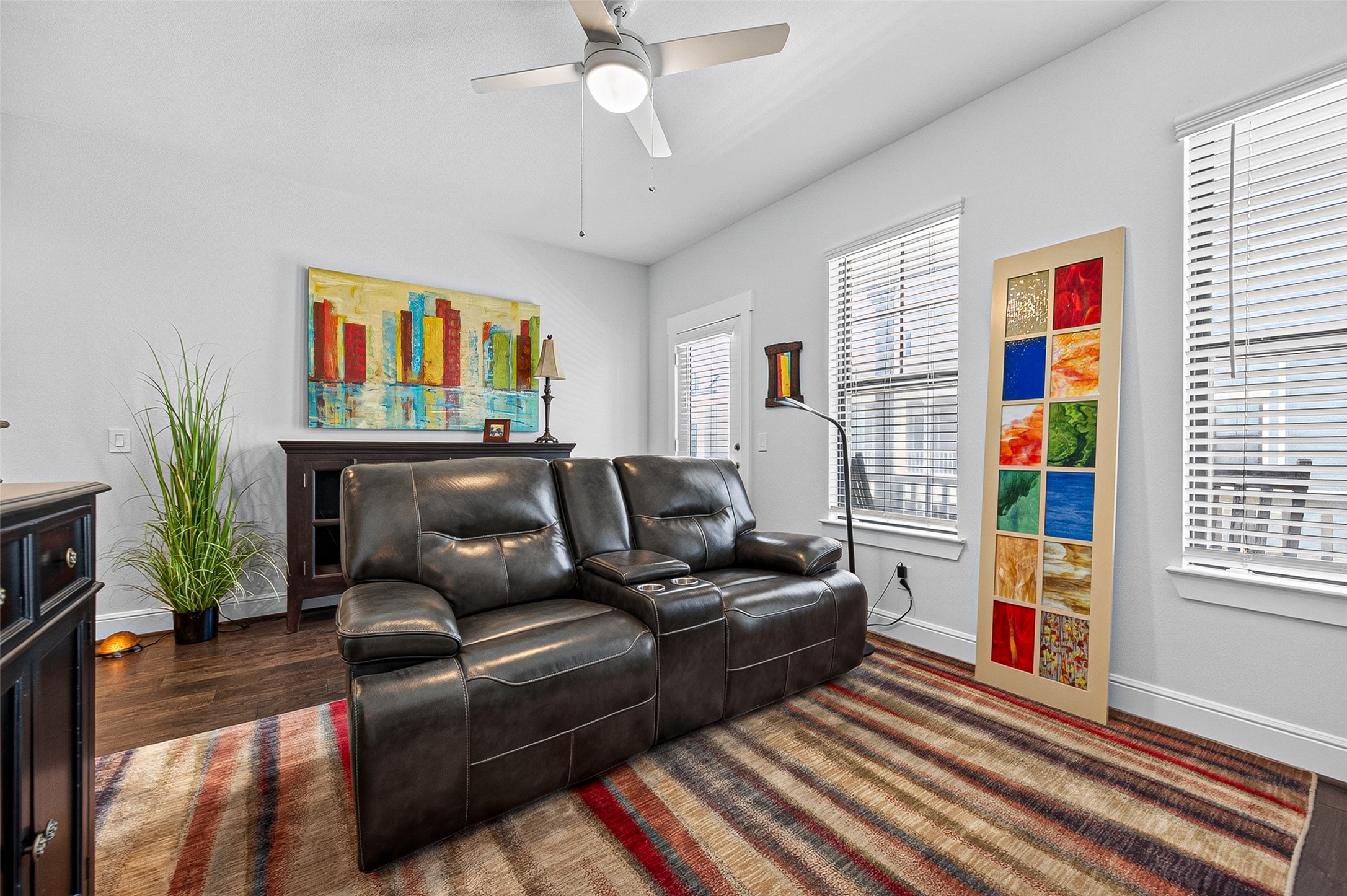 Another good look at this colorful, cozy entertainment room for family and friends to enjoy.