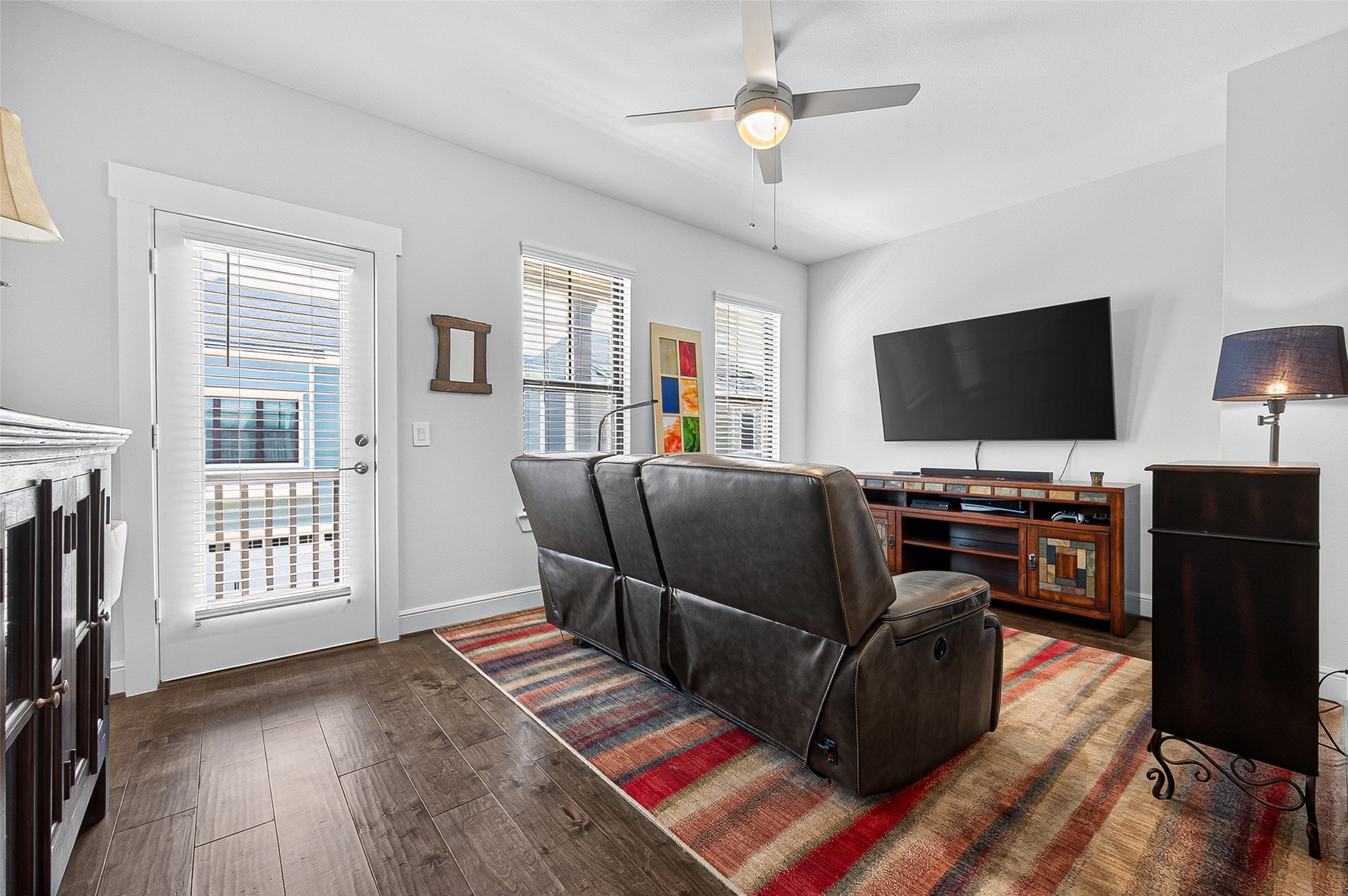 Second living space/gameroom on second level with access to the upper balcony. Plenty of sunshine coming through.