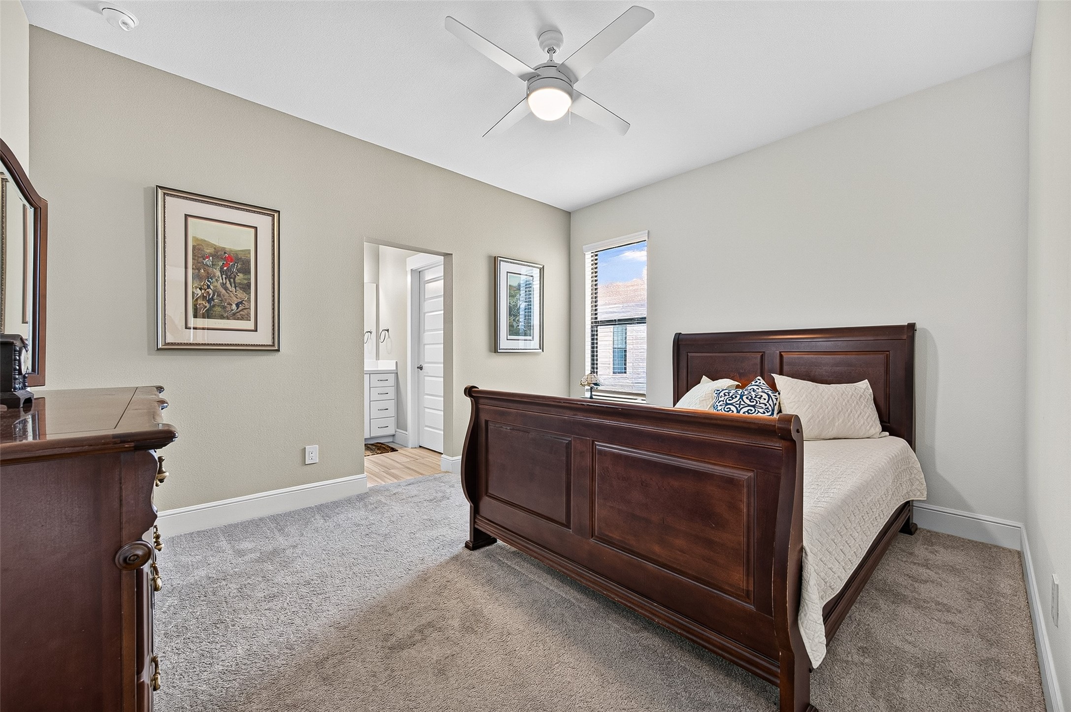 Spacious 2nd bedroom with natural light and private vanity and Hollywood bathroom.
