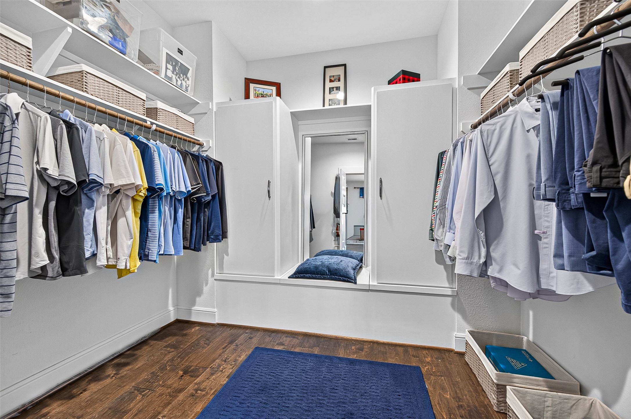 The Primary Closet is oversized with double shelving on top plus storage on either side of the mirror with a top shelf. BONUS - The owner added a Seasonal Storage Door below the mirror.