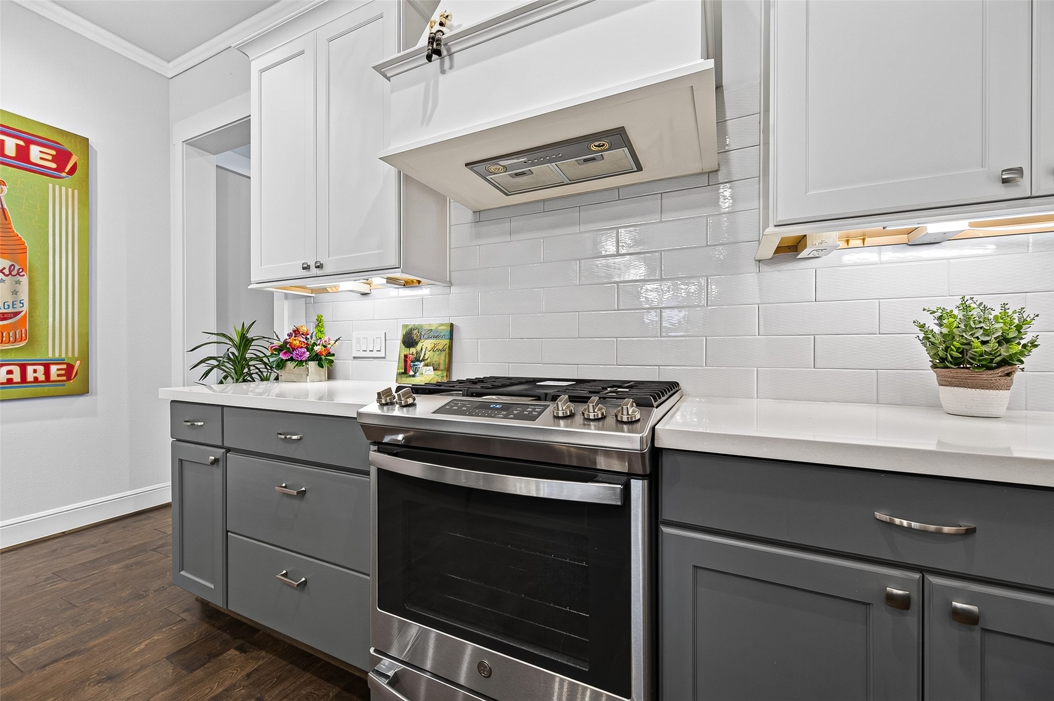 Light, bright and clean look is beautiful with the free-standing gas range.  Under-cabinet lighting and ample storage space.