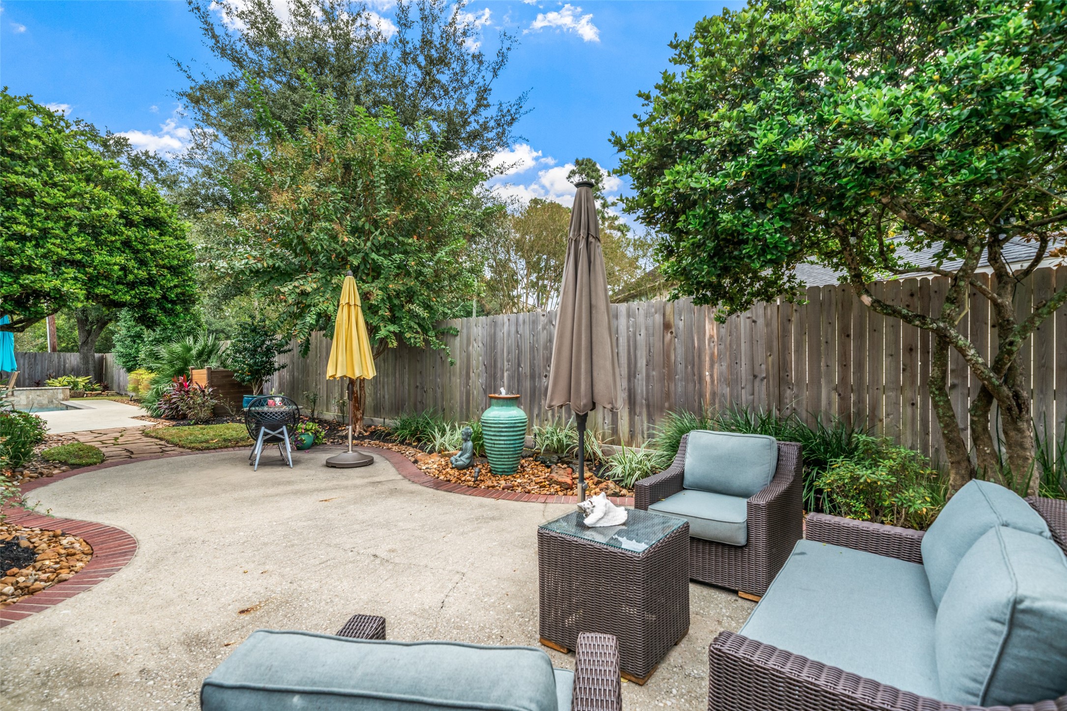 The perfect spot for your morning coffee or tea. The outdoor couch and chairs are included. Some pots are excluded.