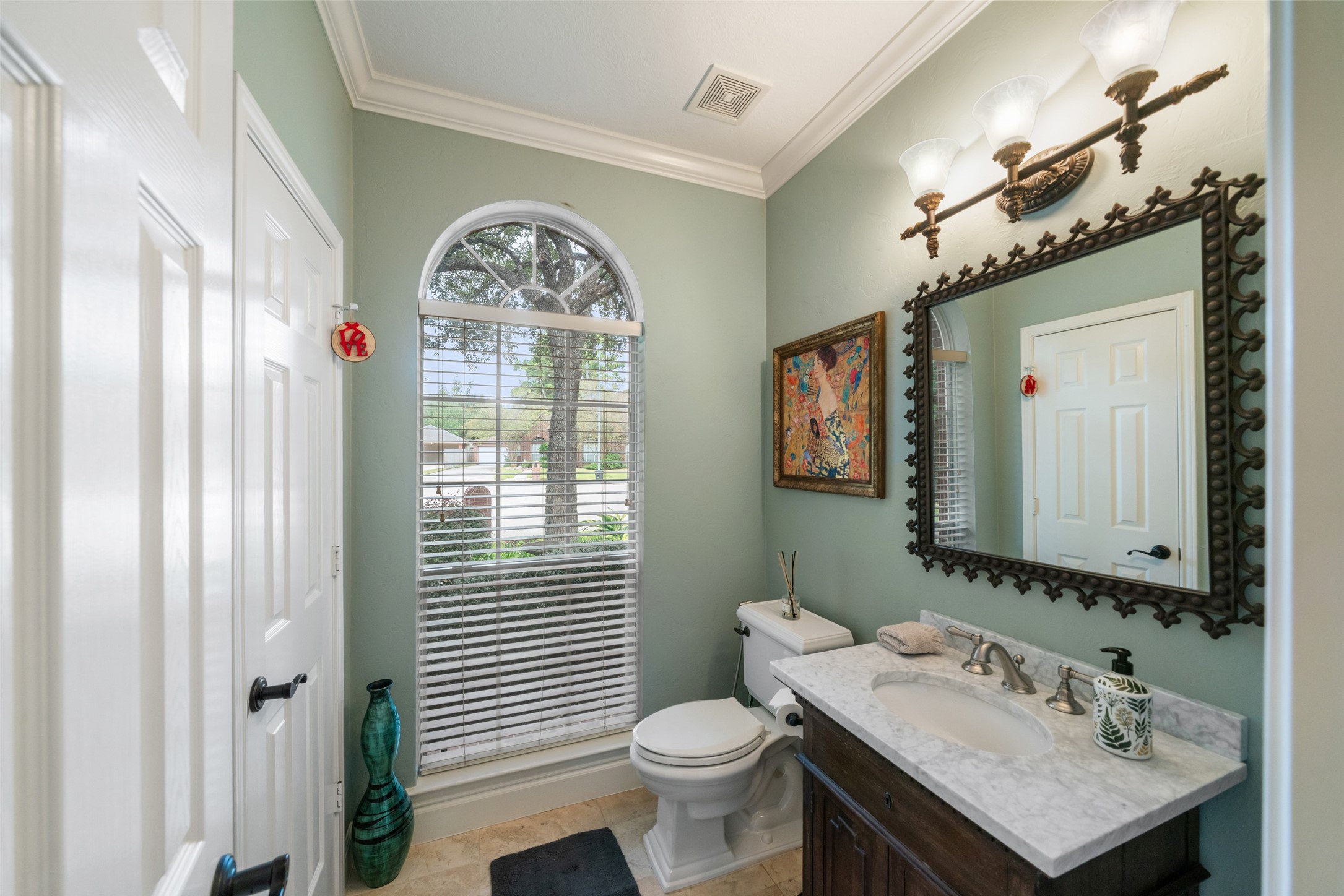Lovely half bath near the home office at the front of the home. An abundance of storage opportunities available throughout.