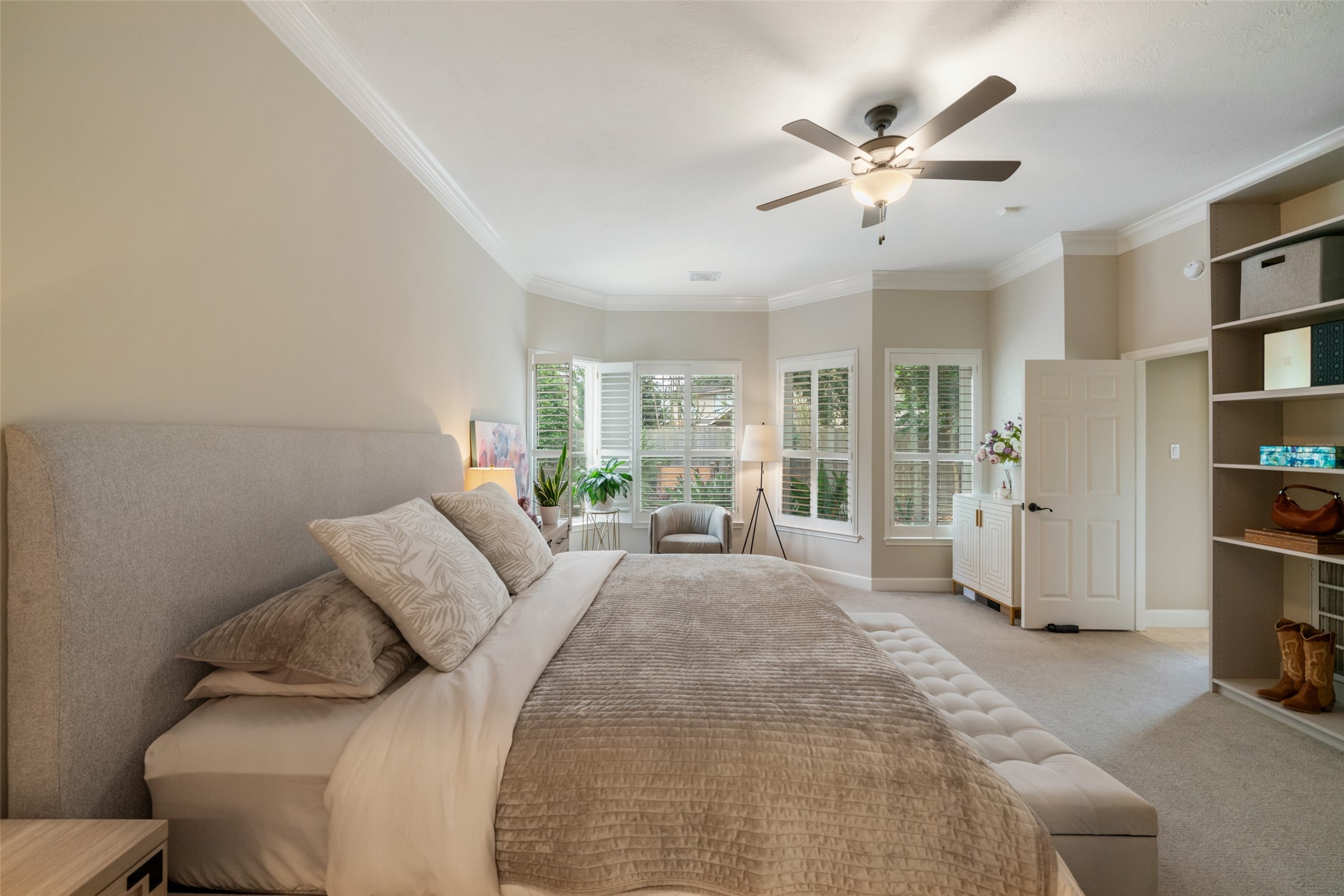 Additional space in the primary for sitting. Open the shutters for a pool view. Lucious landscaping gives the privacy everyone is asking for in a backyard.