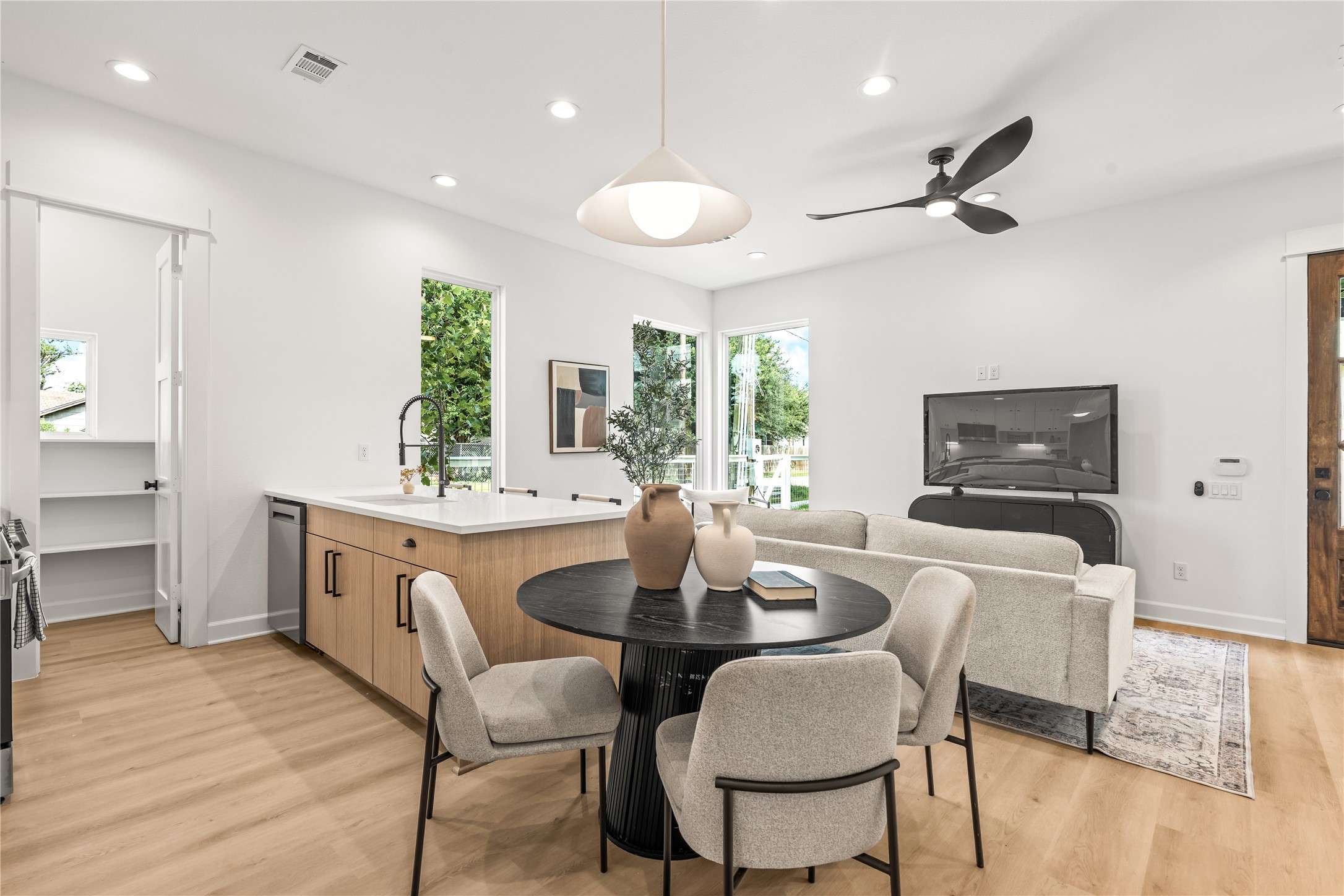 Cozy dining area adjacent to the kitchen island and main living space.