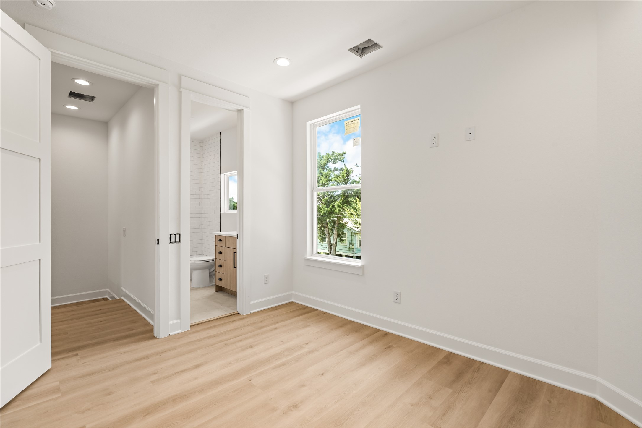 The secondary bedroom's en-suite entry  a full bath for every bedroom, by design
