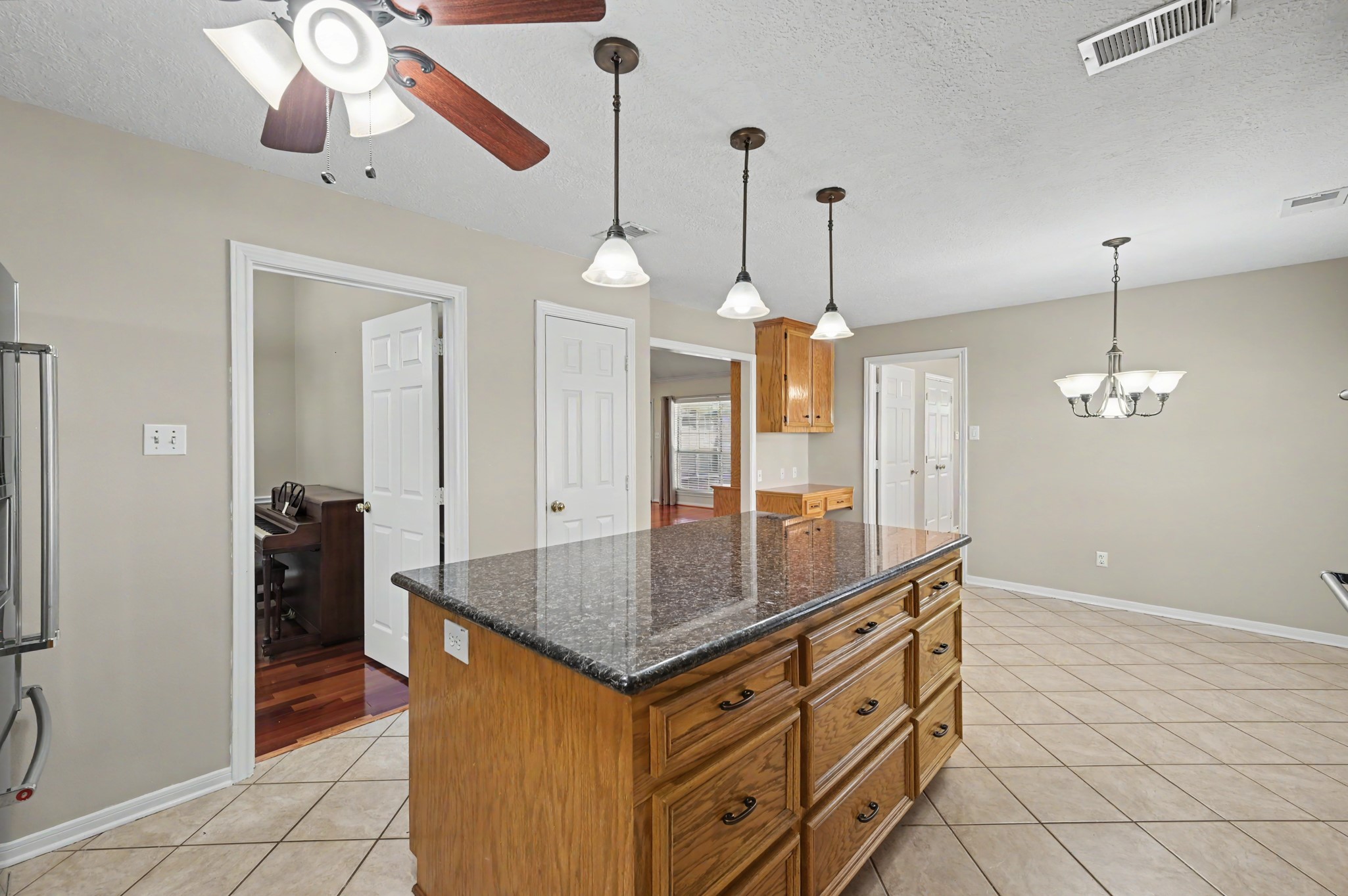 Another view of the kitchen. Beyond, you can see the formal dining area as well as the living room.