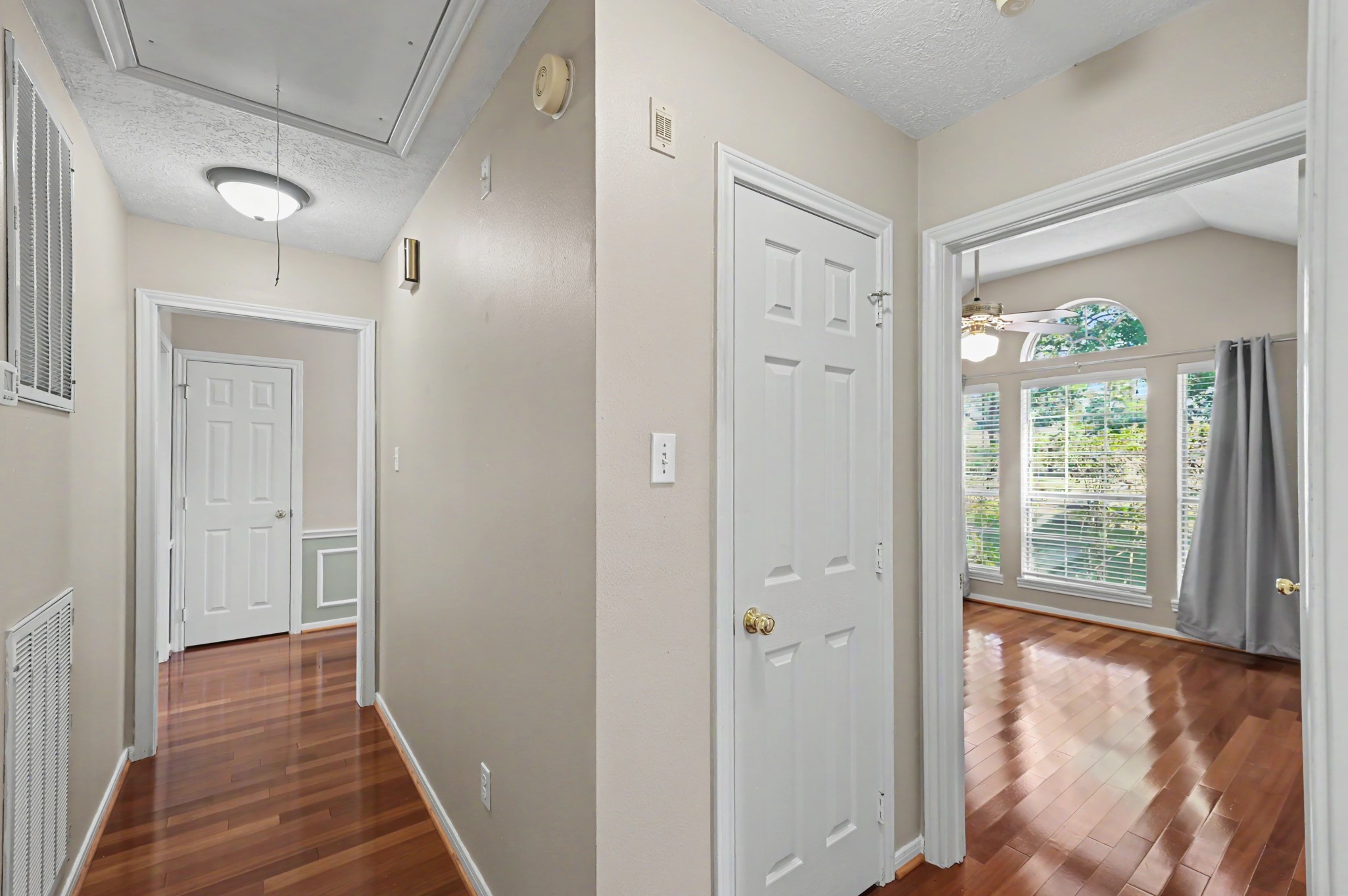 View from the entryway hall, leads to two spacious bedrooms & a full bath.
