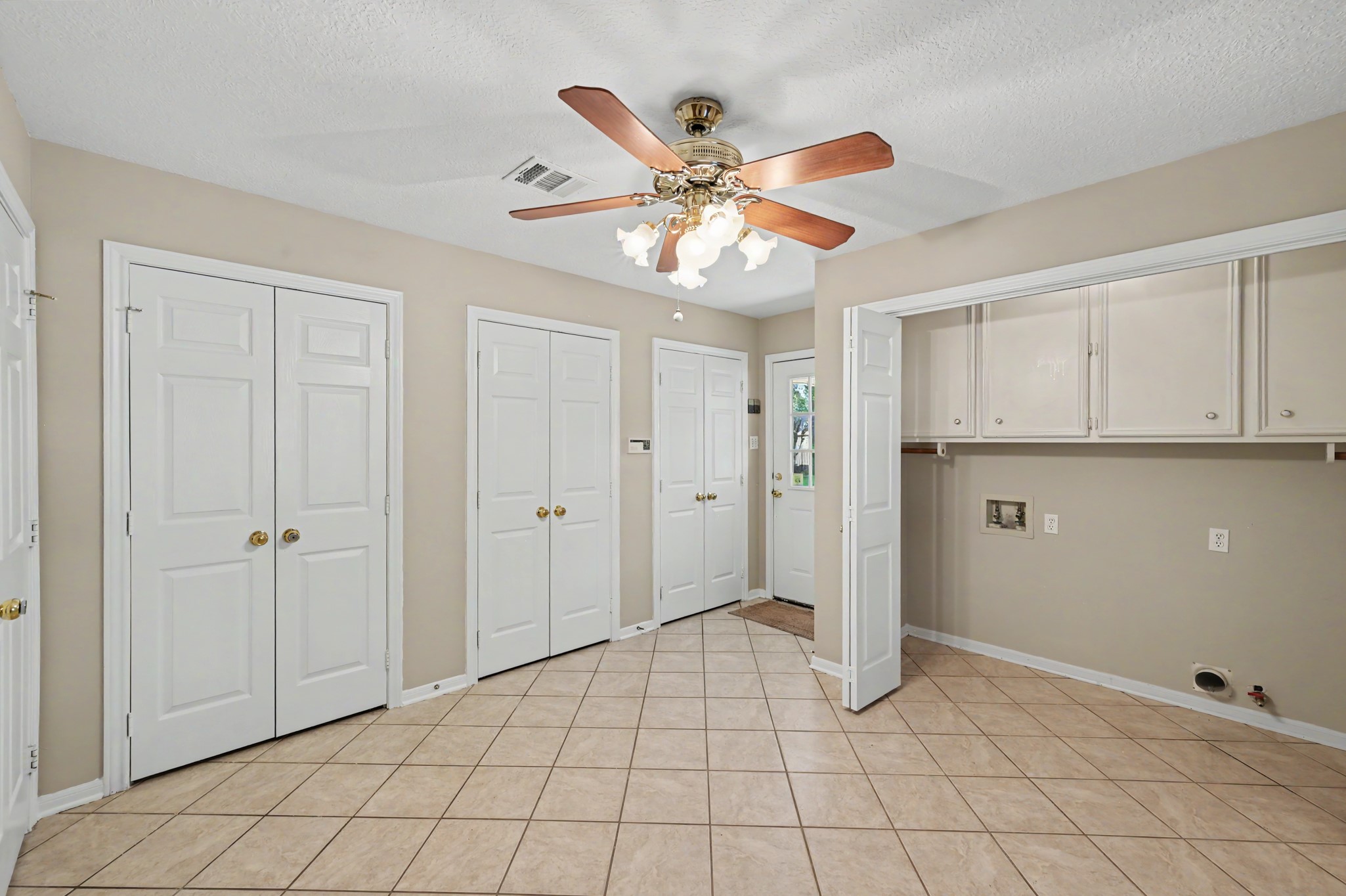 Another view of the office/study space. Door shown leads to the spacious backyard and garage.