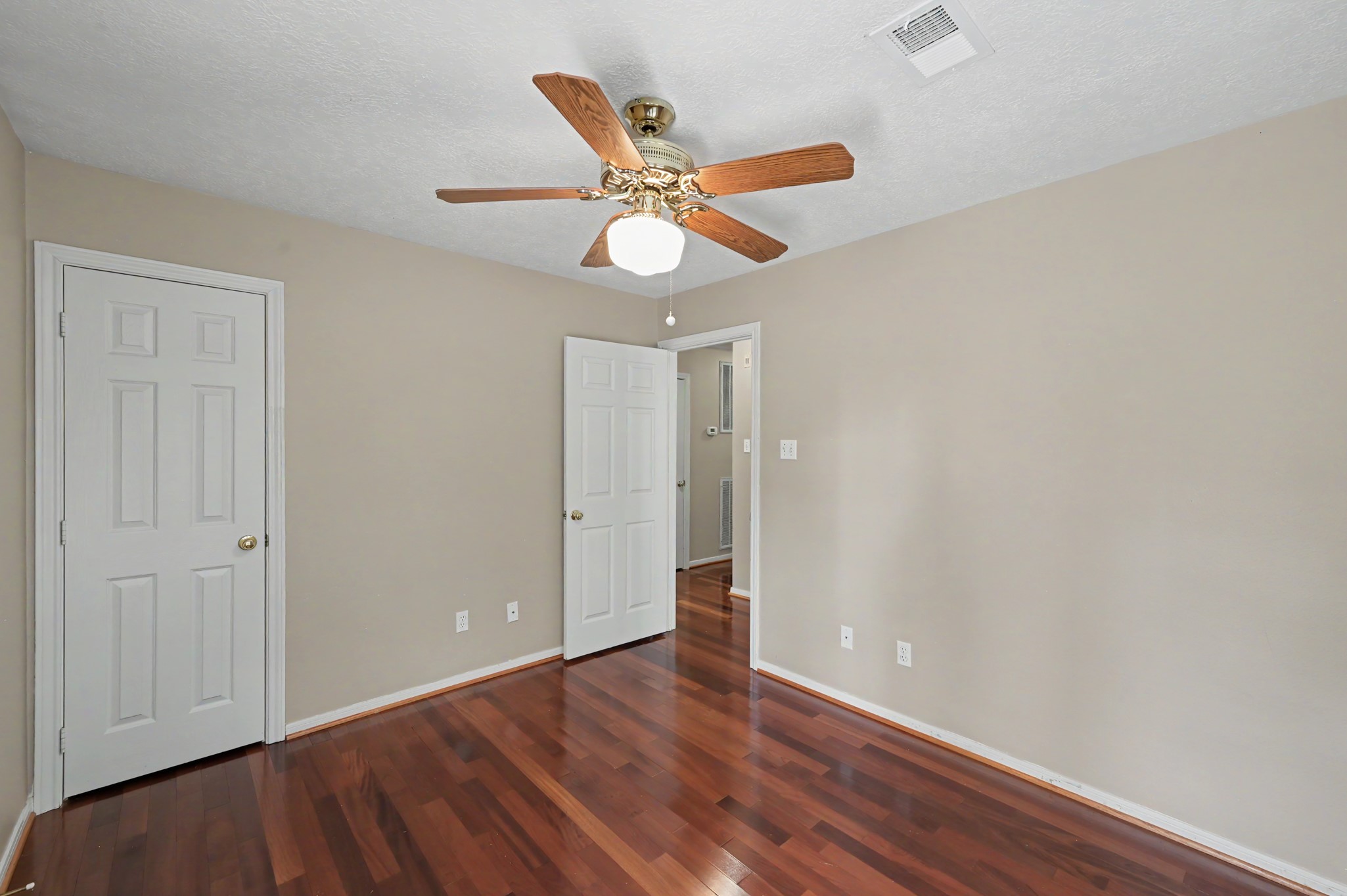 Another view of bedroom three. Walk in closet included.