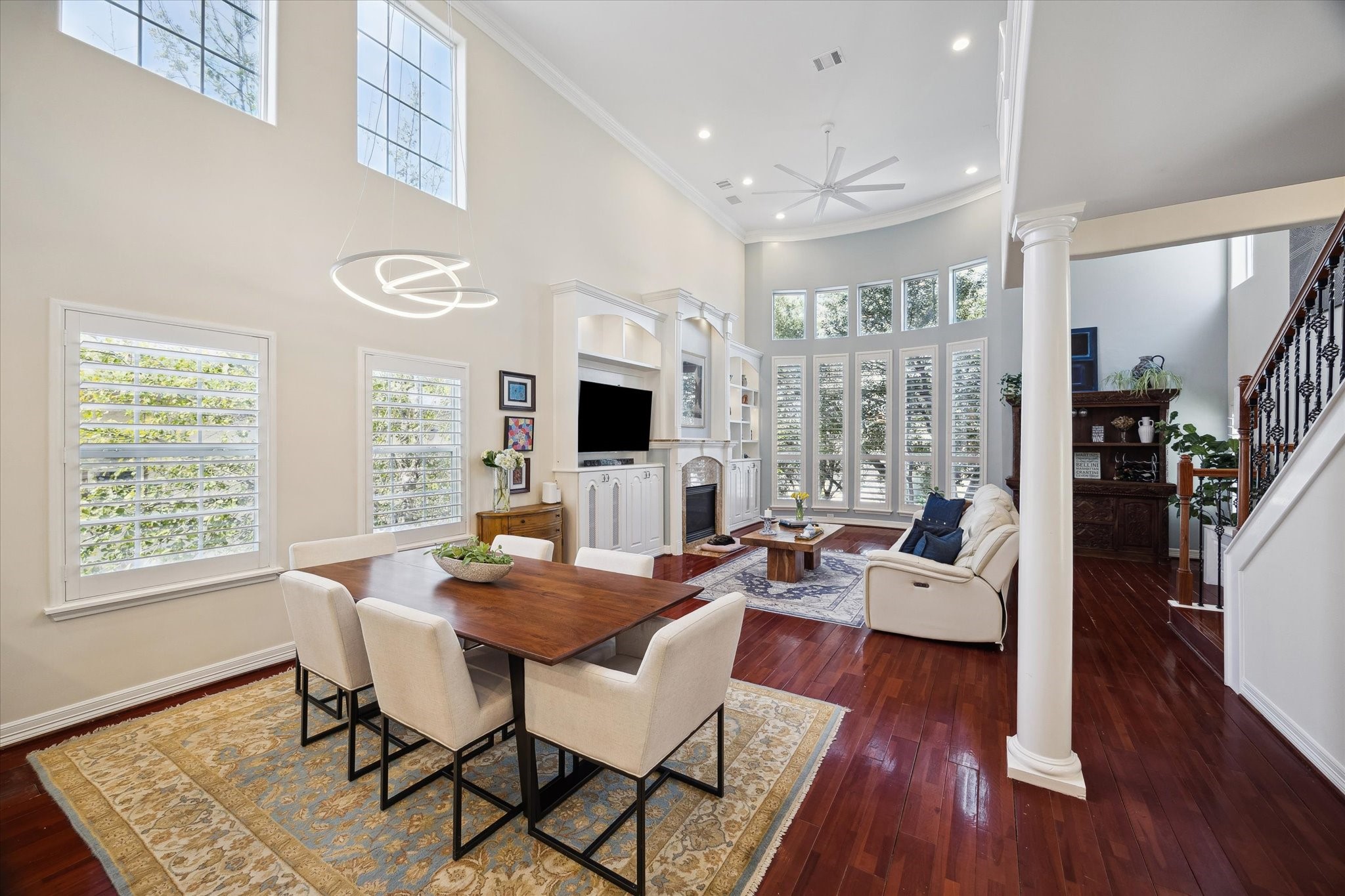 The dining room area is complemented by elegant finishes and hardwood floors, creating a warm and inviting atmosphere.