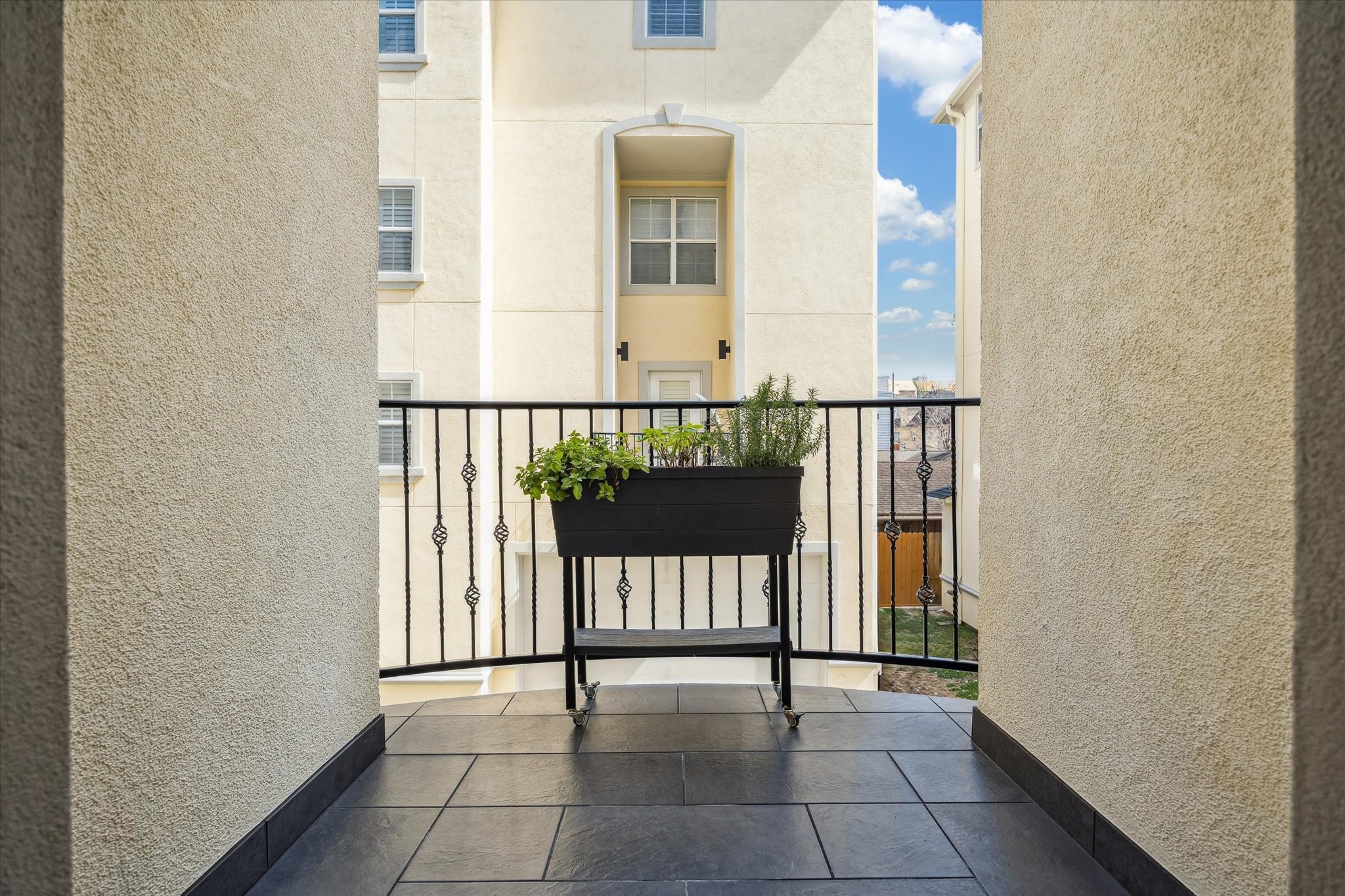 The kitchen-adjacent balcony is a functional stylish space, think a bistro set to enjoy your morning hot drink, a planter with your favorite herbs....