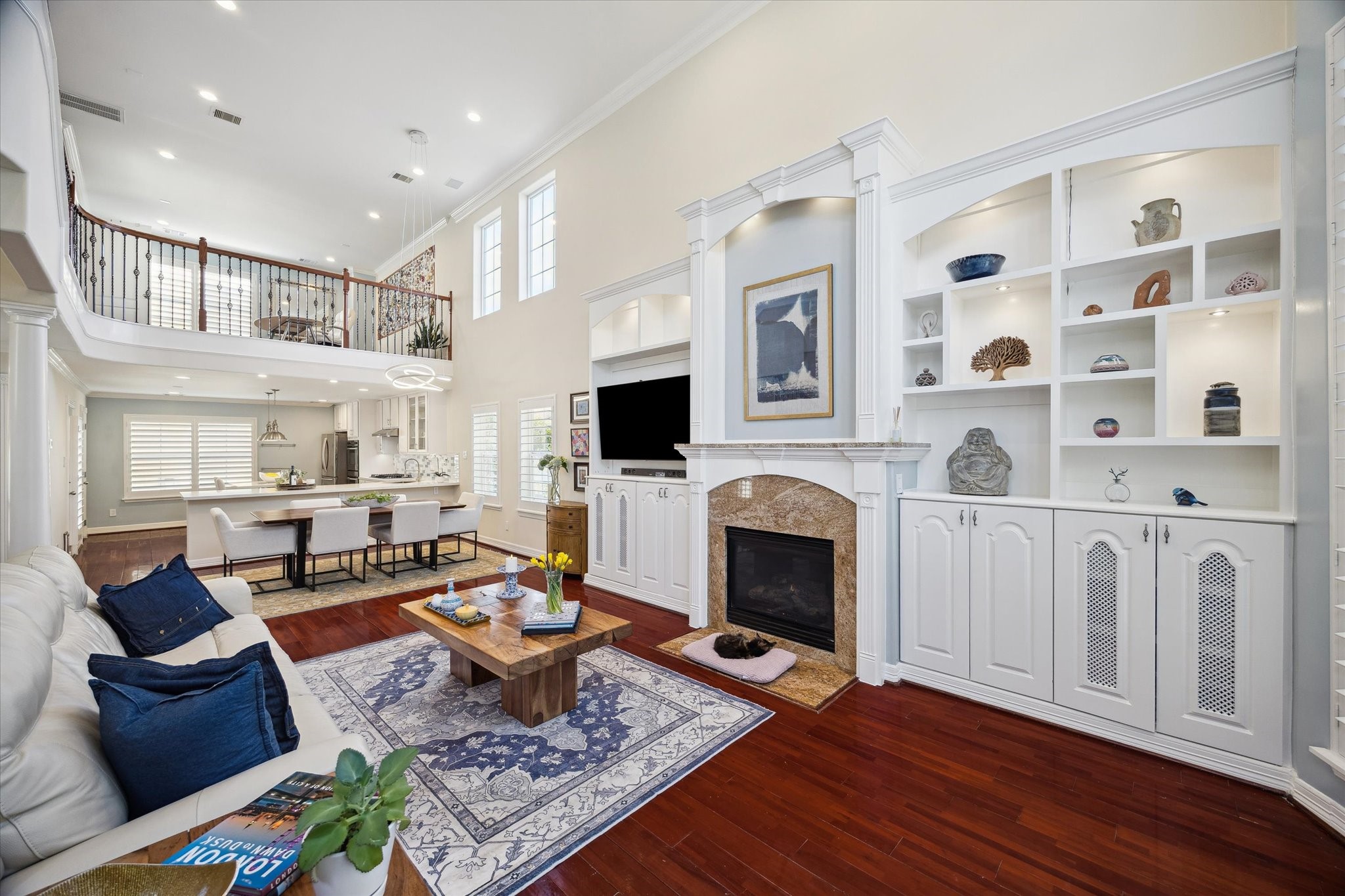 Open layout connecting to the dining and kitchen areas. The room is bright and inviting.
